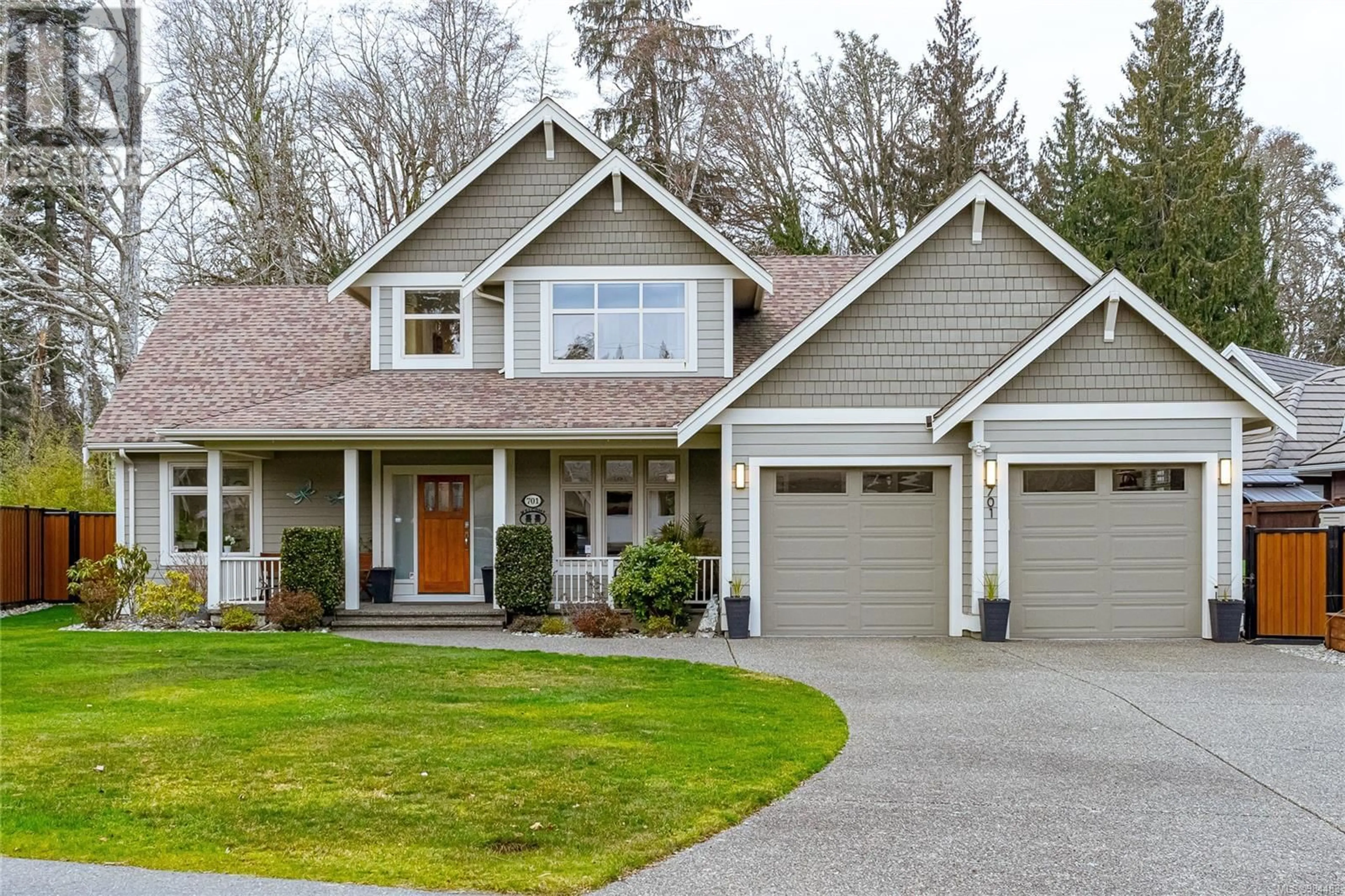 Home with vinyl exterior material, street for 701 Garrett Rd, Qualicum Beach British Columbia V9K1L4