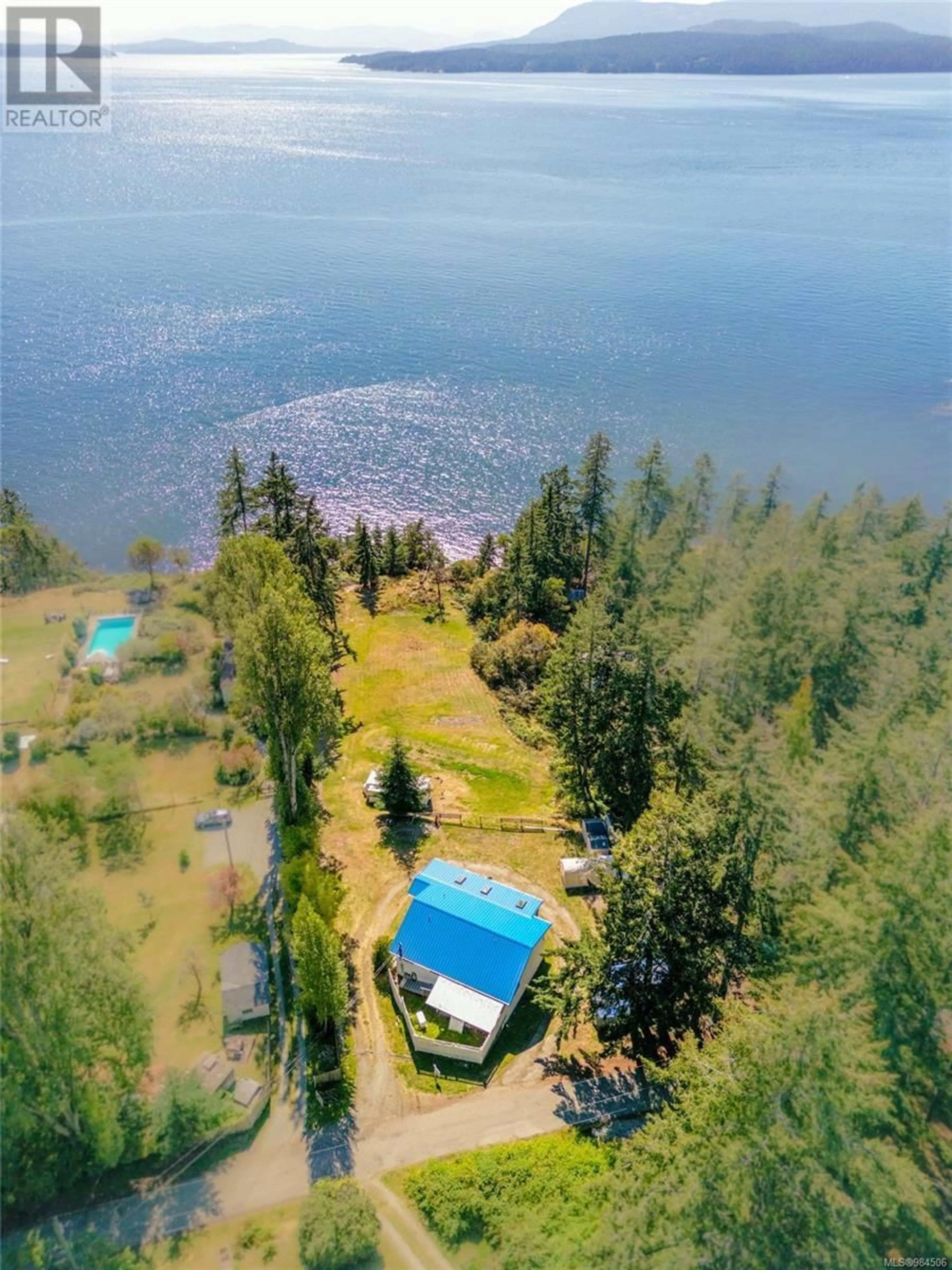 A pic from outside/outdoor area/front of a property/back of a property/a pic from drone, water/lake/river/ocean view for 1325 Mackinnon Rd, Pender Island British Columbia V0N2M1