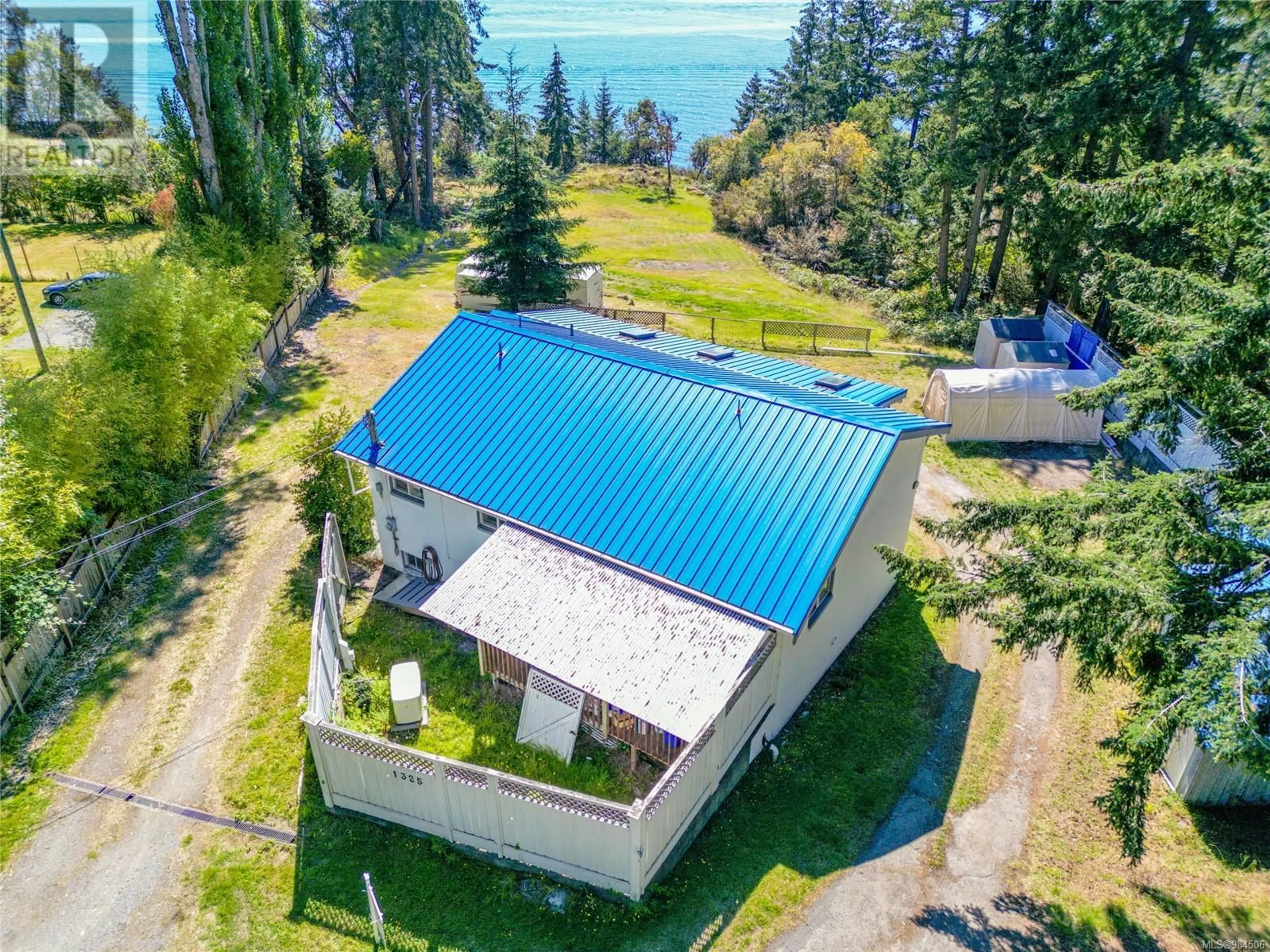 A pic from outside/outdoor area/front of a property/back of a property/a pic from drone, water/lake/river/ocean view for 1325 Mackinnon Rd, Pender Island British Columbia V0N2M1