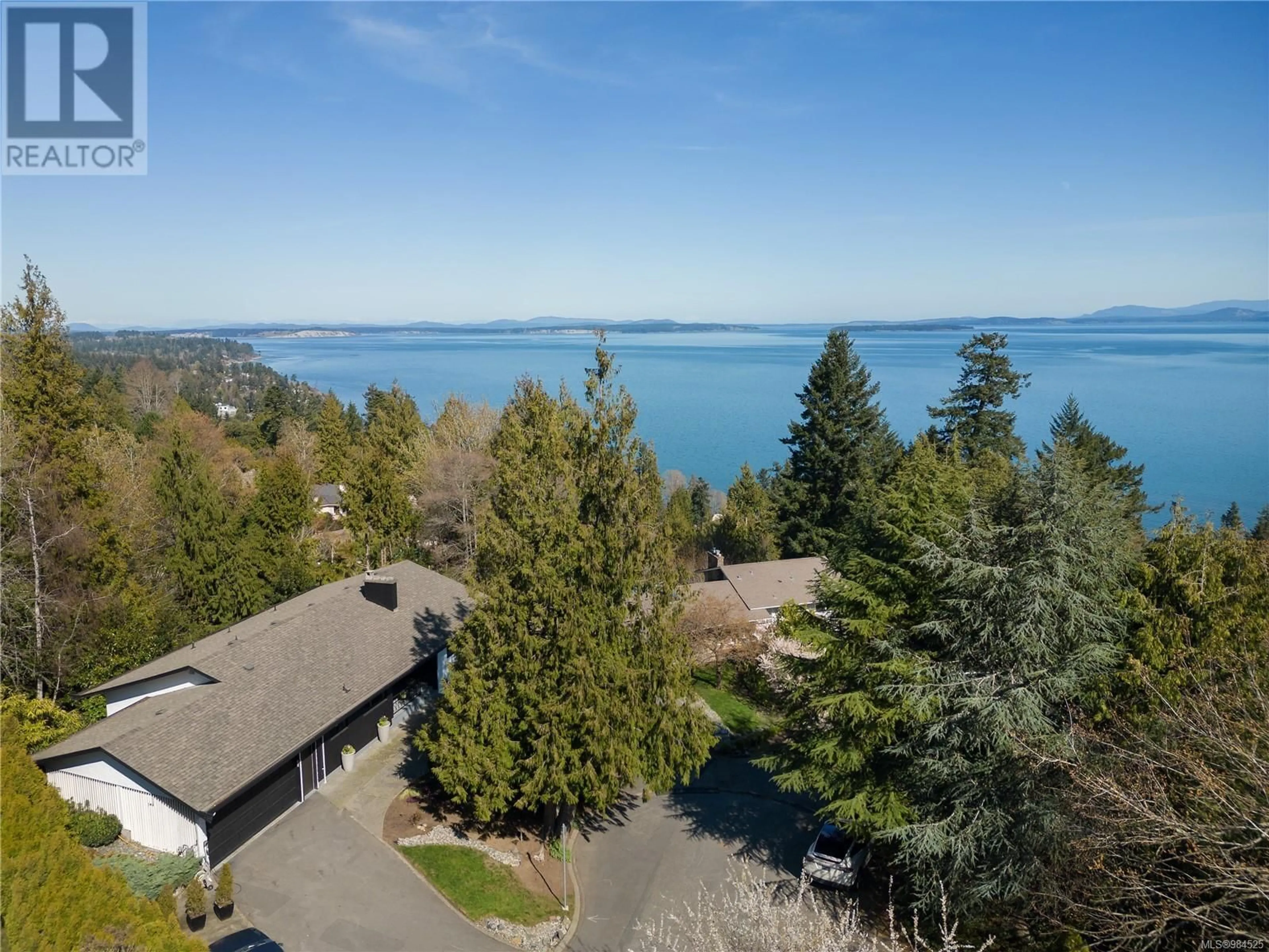 A pic from outside/outdoor area/front of a property/back of a property/a pic from drone, water/lake/river/ocean view for 966 Saturna Pl, Saanich British Columbia V8Y1H4