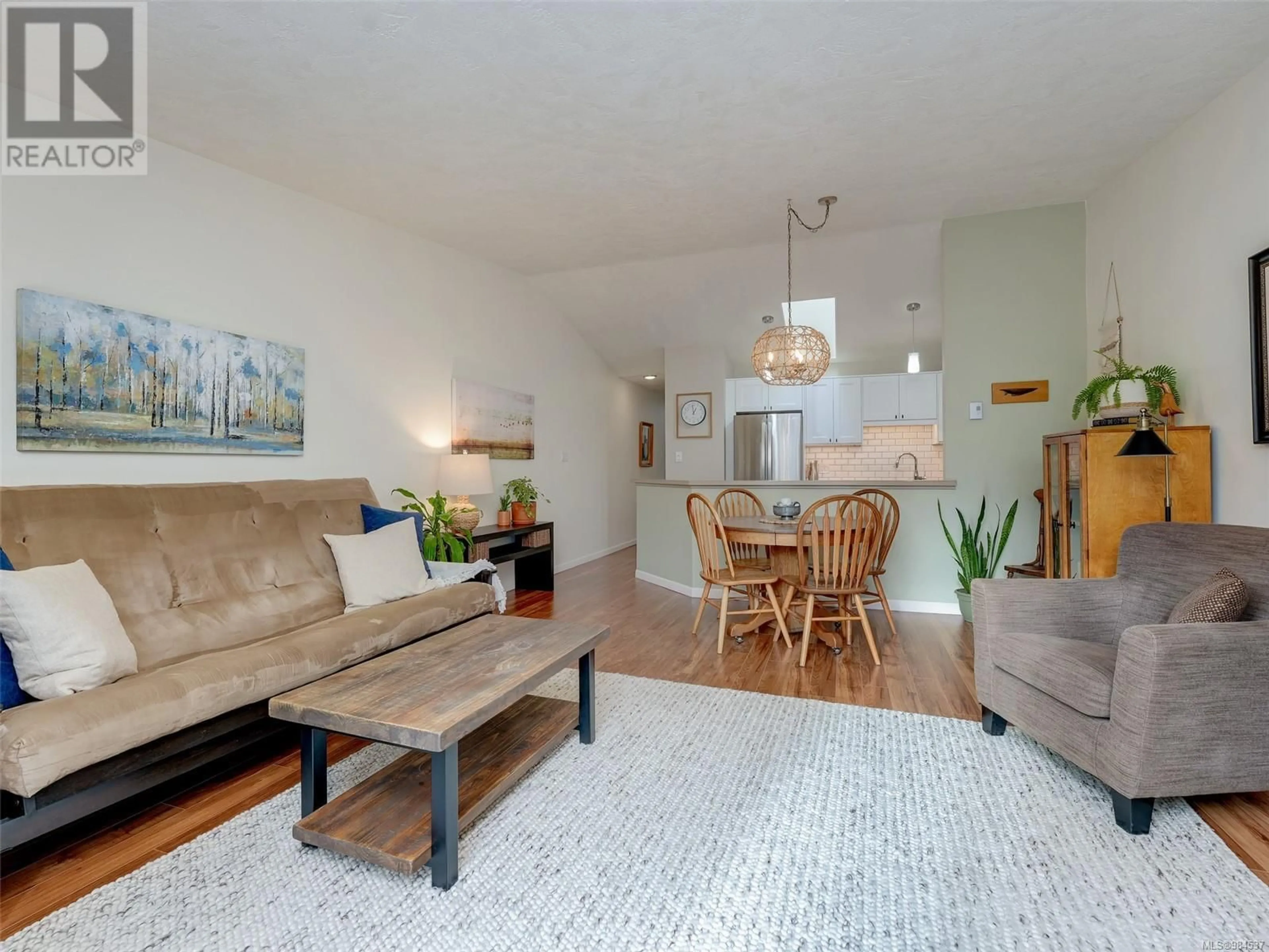 Living room with furniture, wood/laminate floor for 62 2070 Amelia Ave, Sidney British Columbia V8L4X6