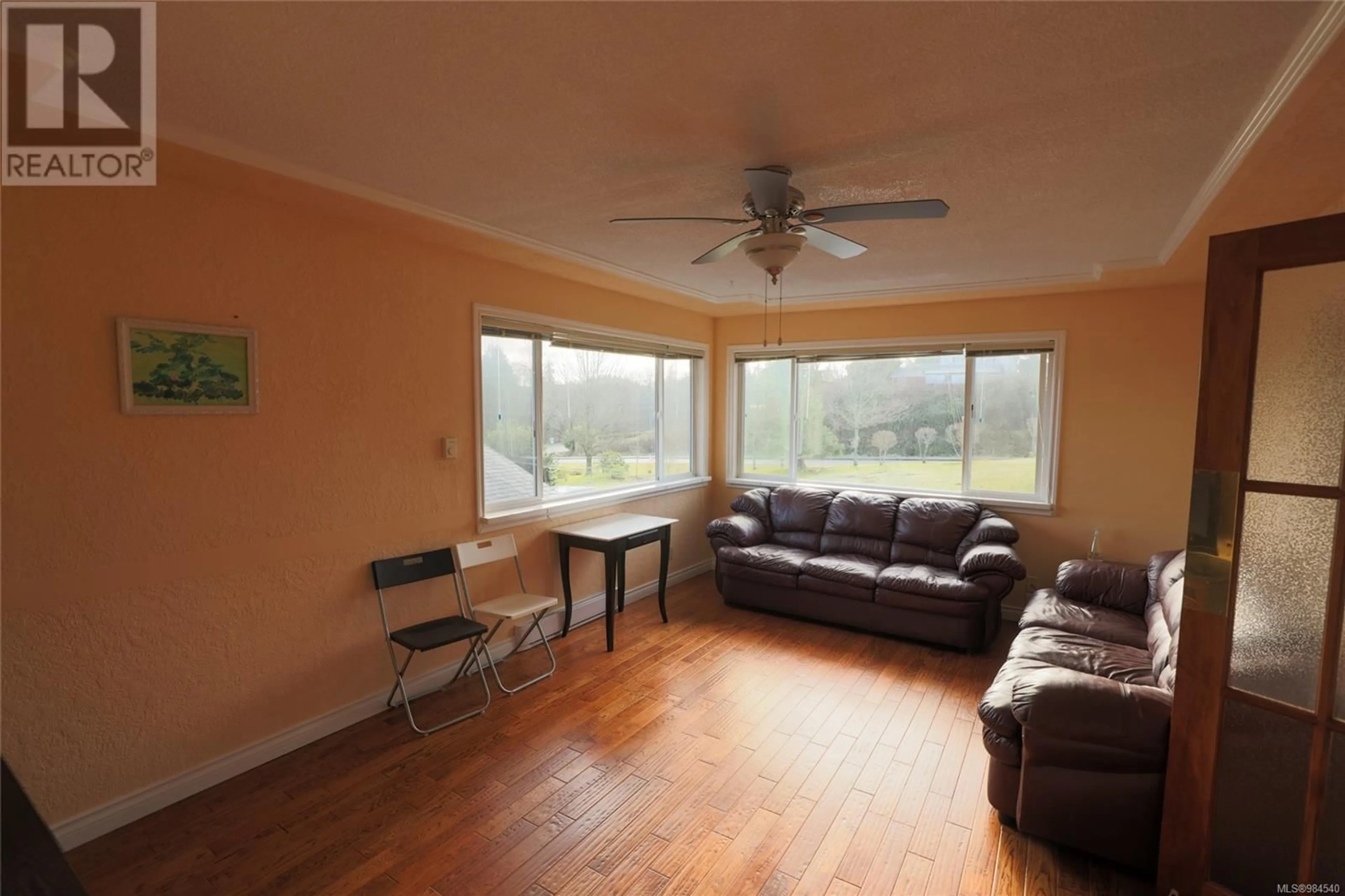 Living room with furniture, wood/laminate floor for 8840 Douglas St, Port Hardy British Columbia V0N2P0