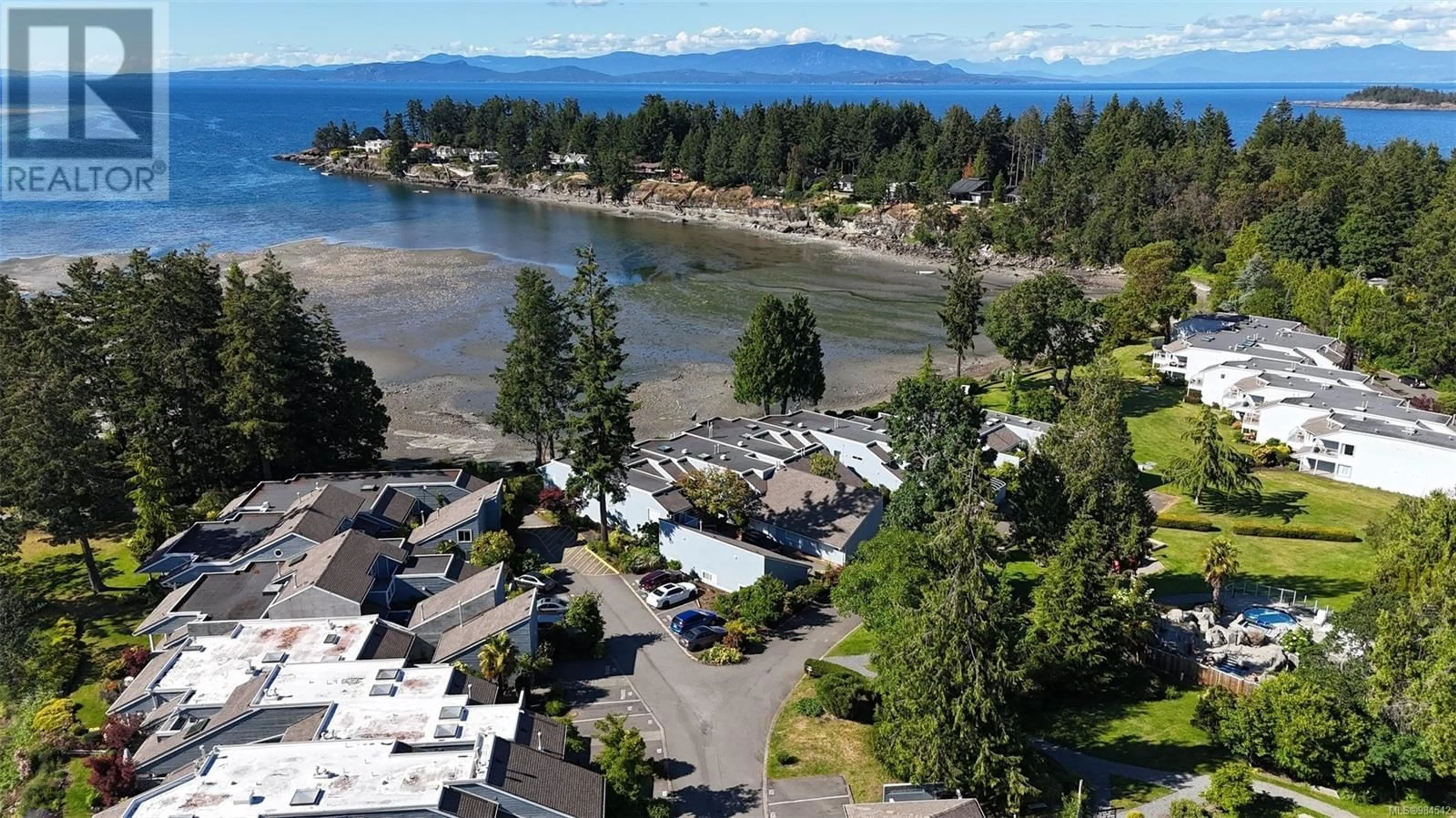 A pic from outside/outdoor area/front of a property/back of a property/a pic from drone, water/lake/river/ocean view for 521 1600 Stroulger Rd, Nanoose Bay Alberta V9Z0T1