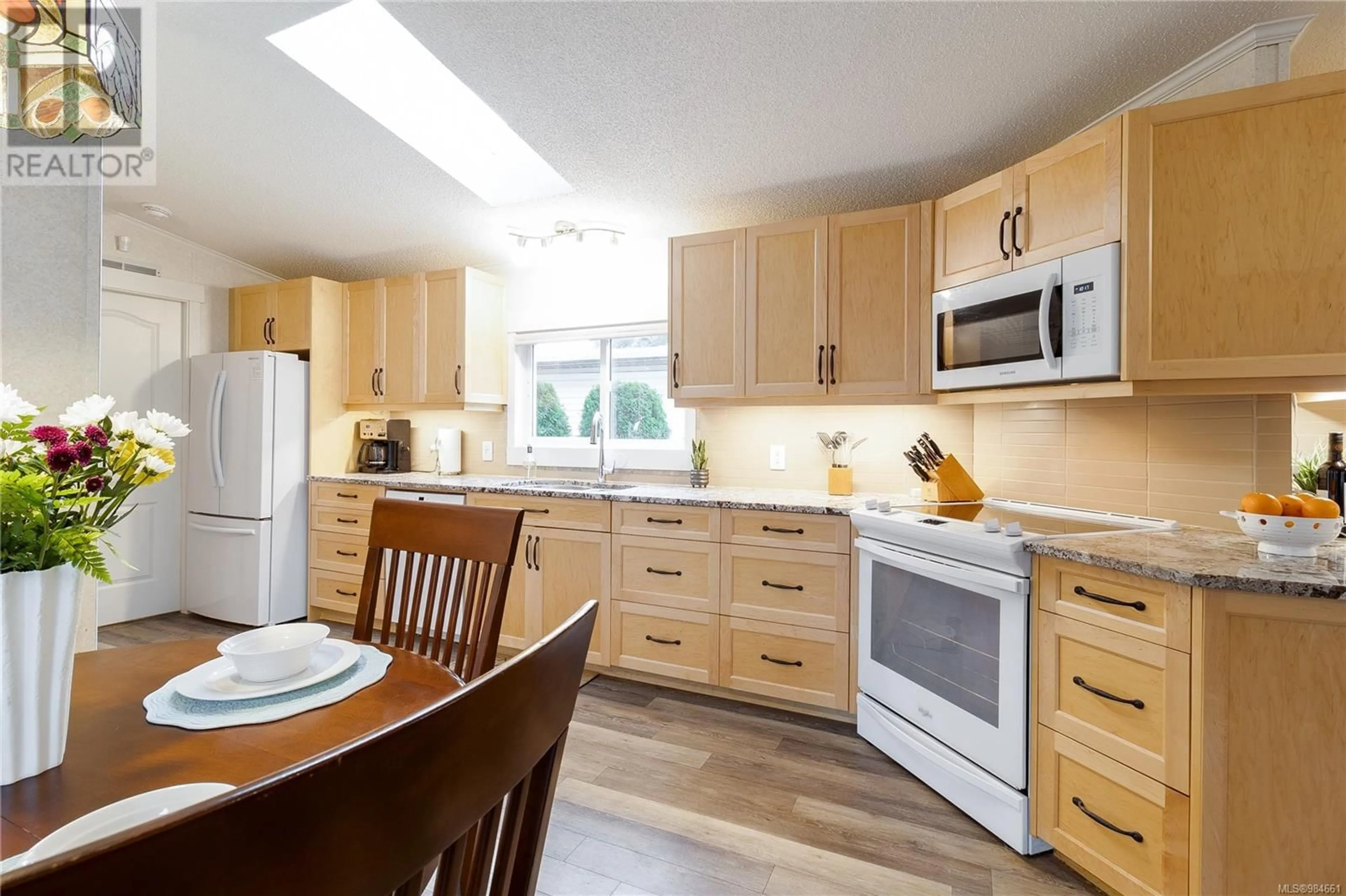 Open concept kitchen, wood/laminate floor for 50 5854 Turner Rd, Nanaimo British Columbia V9T2N6