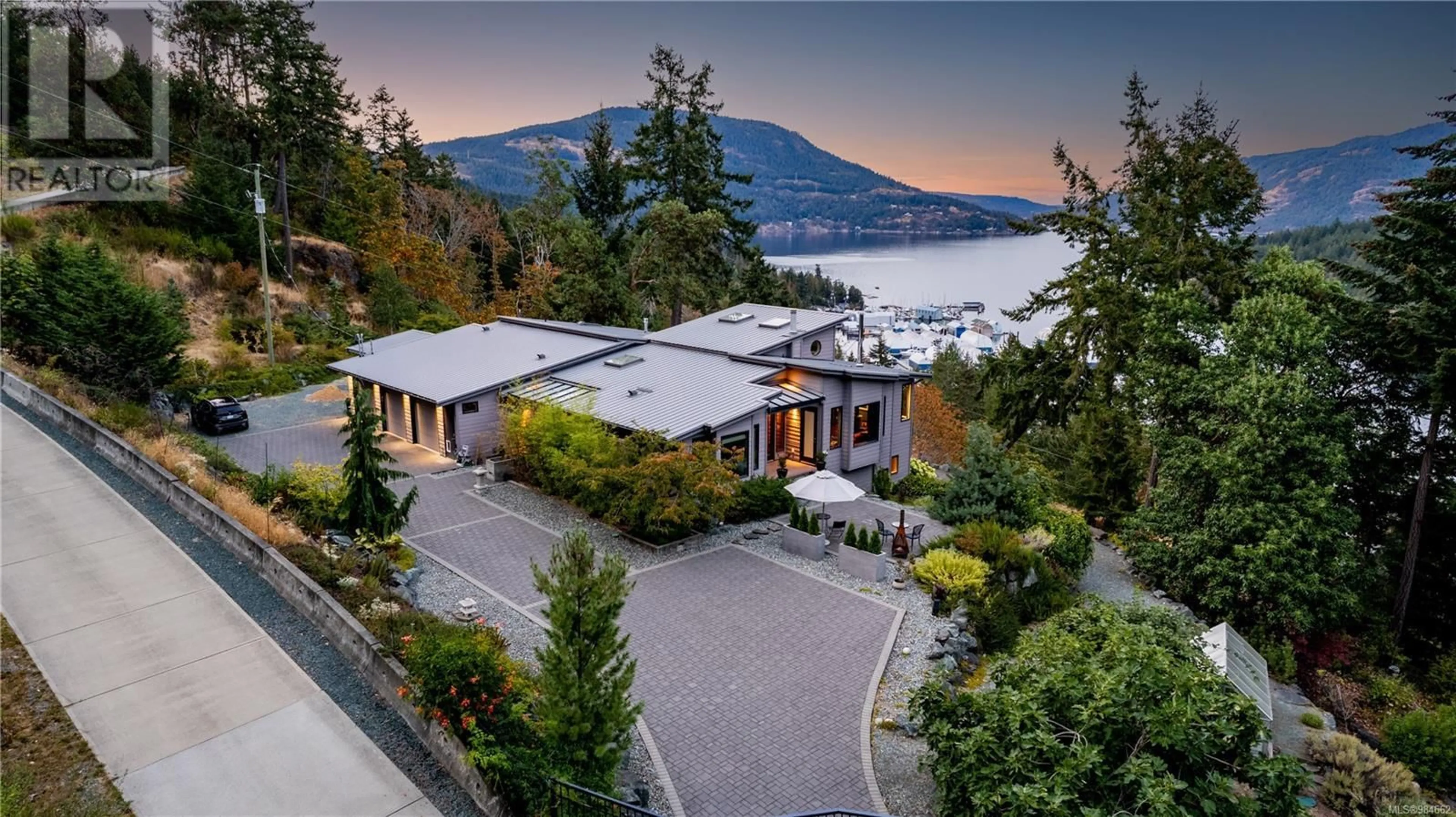 A pic from outside/outdoor area/front of a property/back of a property/a pic from drone, mountain view for 6088 Genoa Bay Rd, Duncan British Columbia V9L5Y5