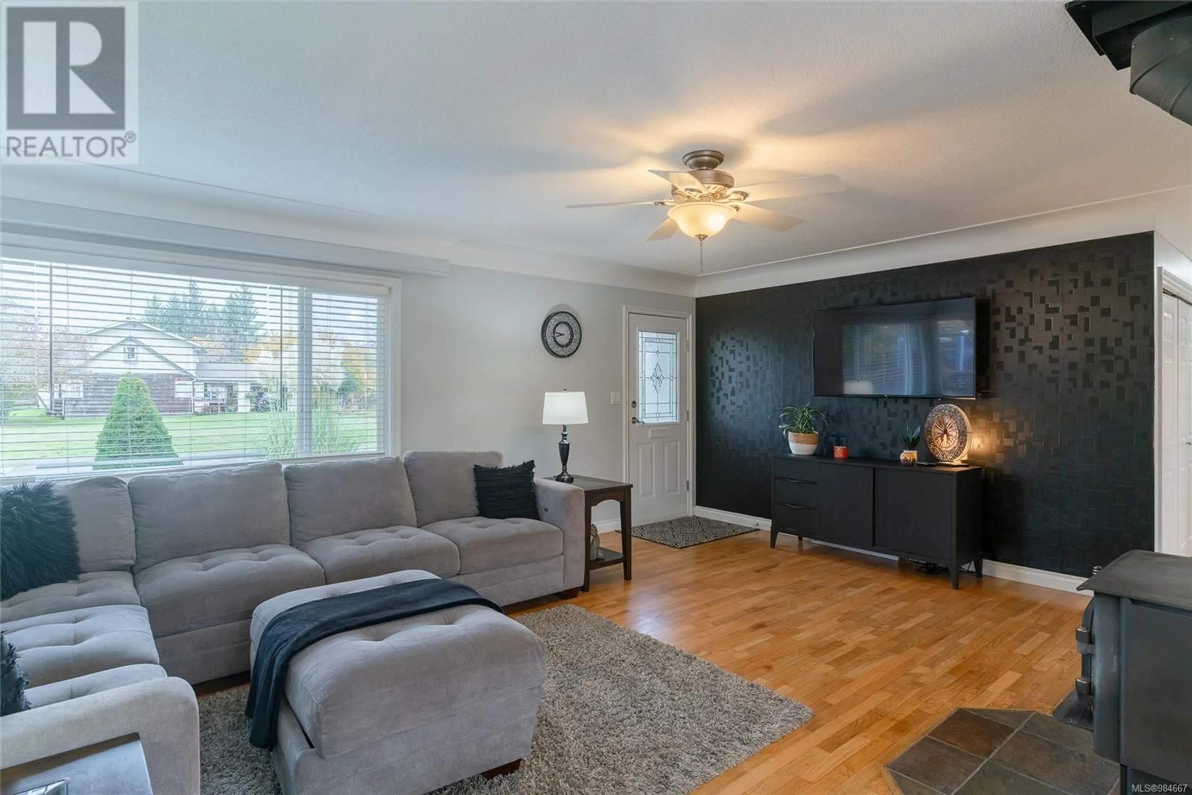 Living room with furniture, wood/laminate floor for 6290 Compton Rd, Port Alberni British Columbia V9Y7B8