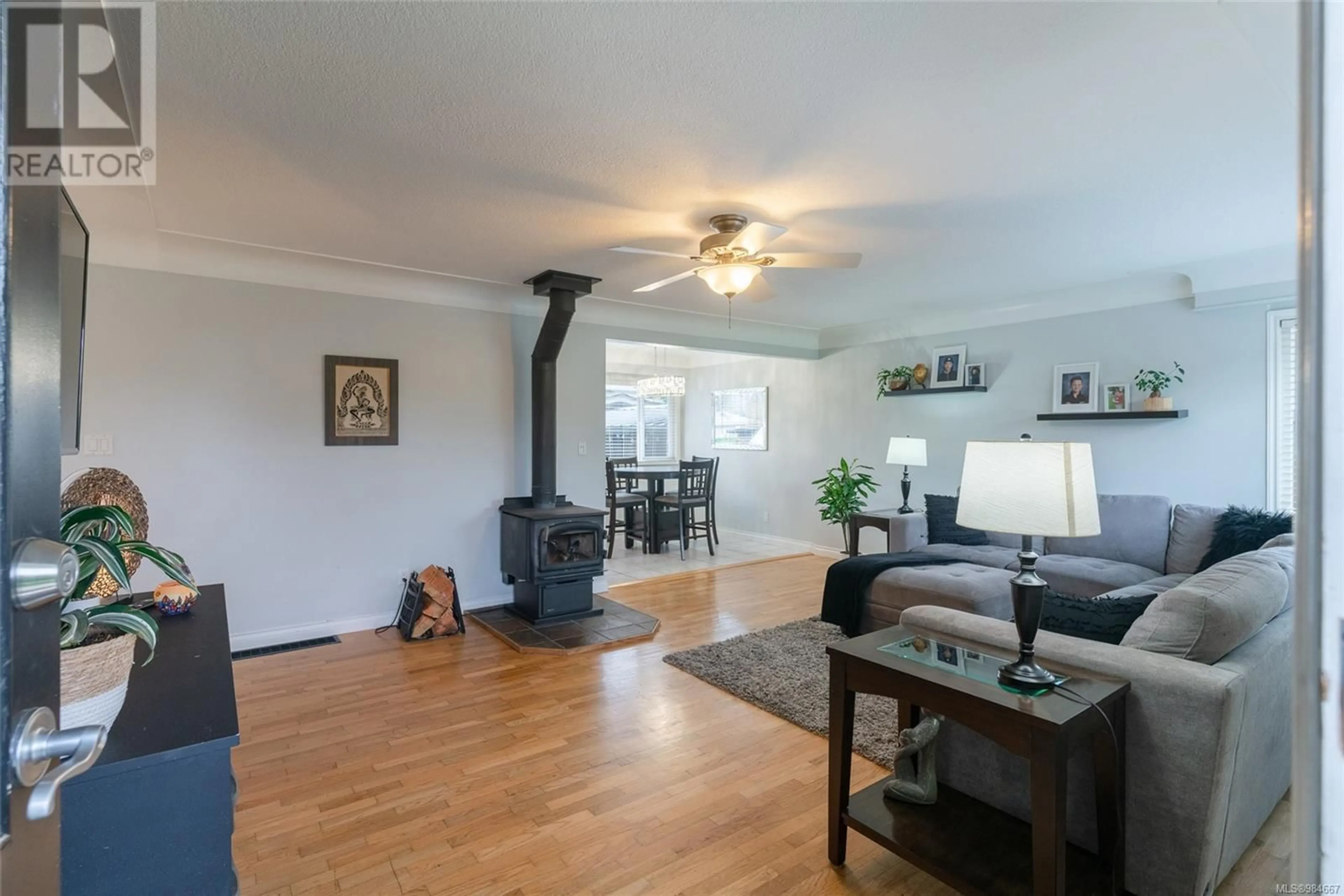 Living room with furniture, wood/laminate floor for 6290 Compton Rd, Port Alberni British Columbia V9Y7B8