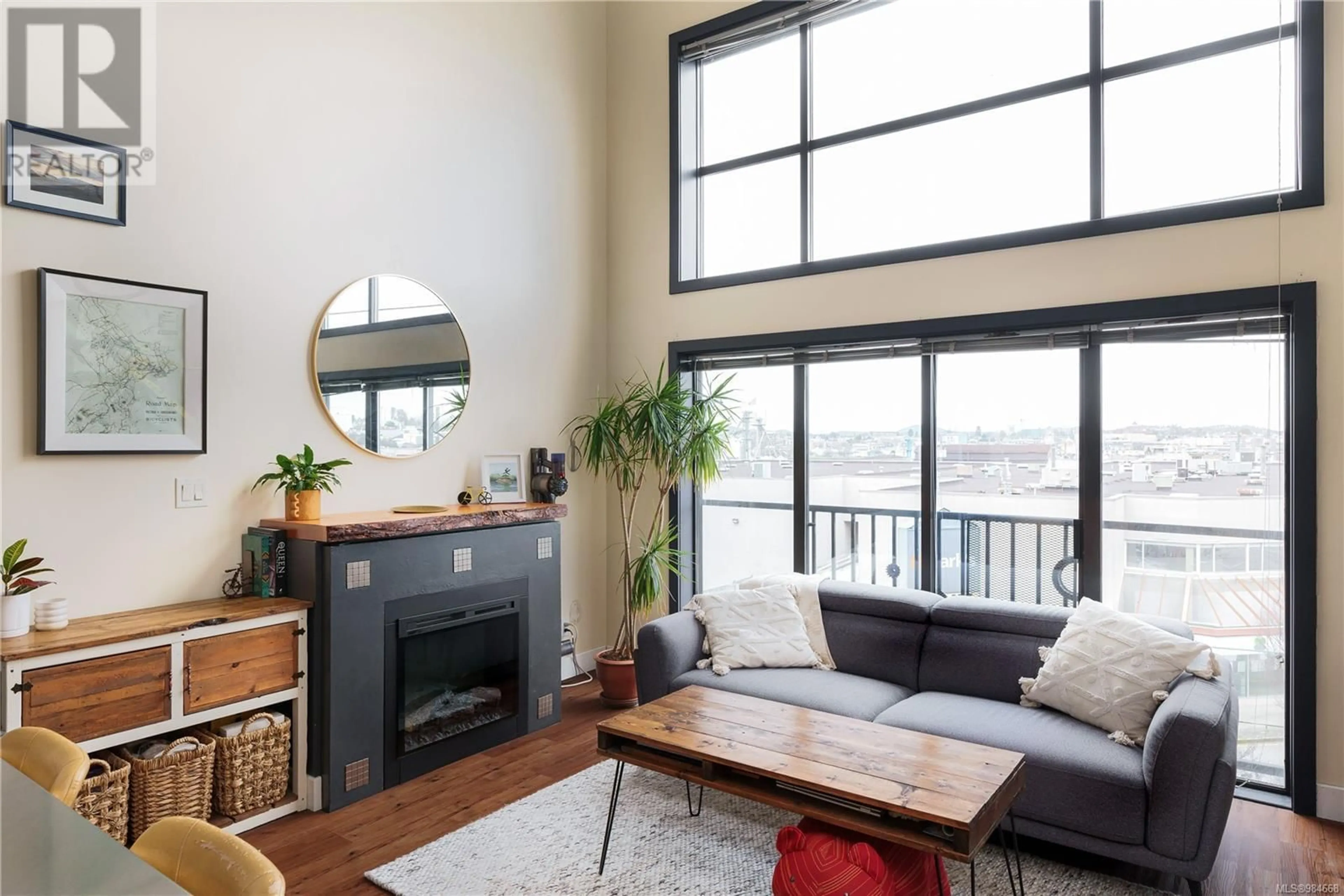 Living room with furniture, wood/laminate floor for 303 555 Chatham St, Victoria British Columbia V8T1E1