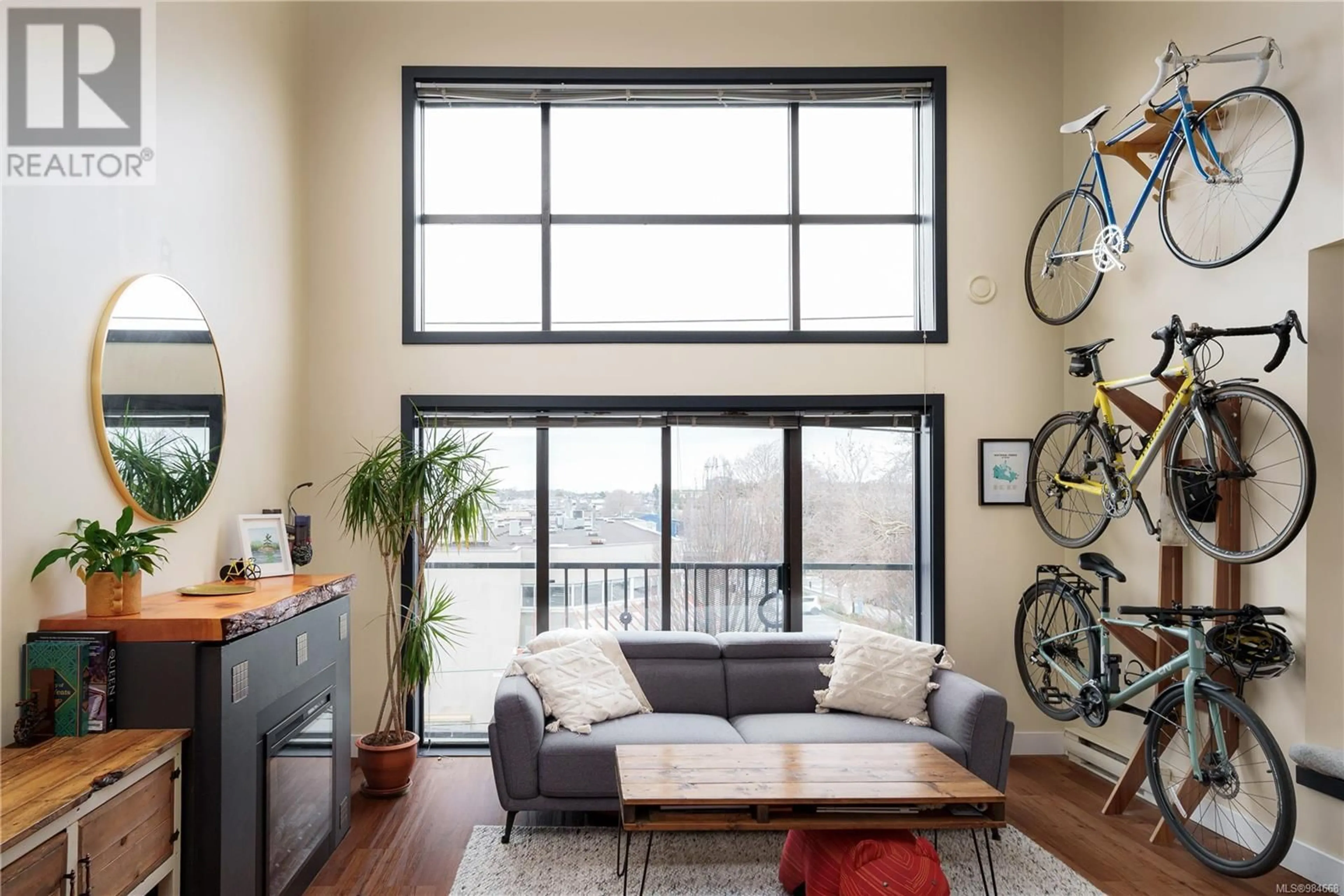 Living room with furniture, wood/laminate floor for 303 555 Chatham St, Victoria British Columbia V8T1E1