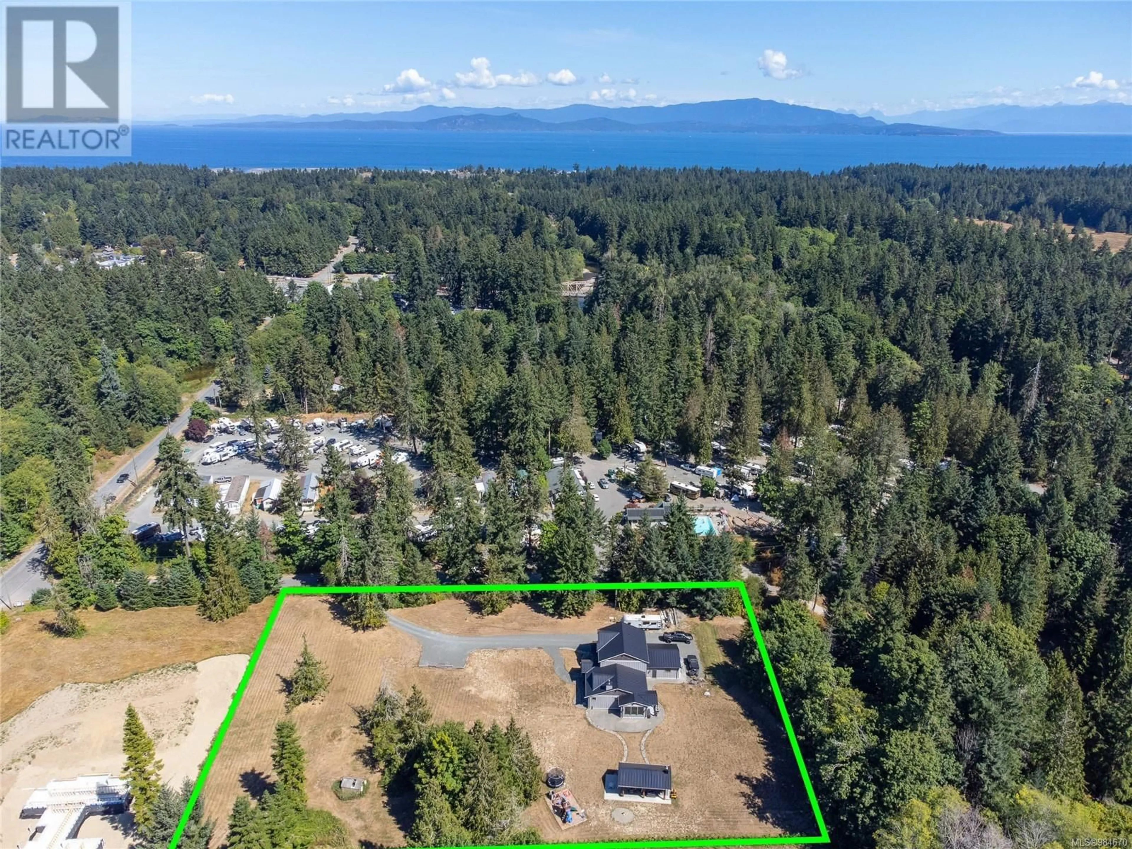 A pic from outside/outdoor area/front of a property/back of a property/a pic from drone, water/lake/river/ocean view for 730 Parry's Park Rd, Parksville British Columbia V9P1T8