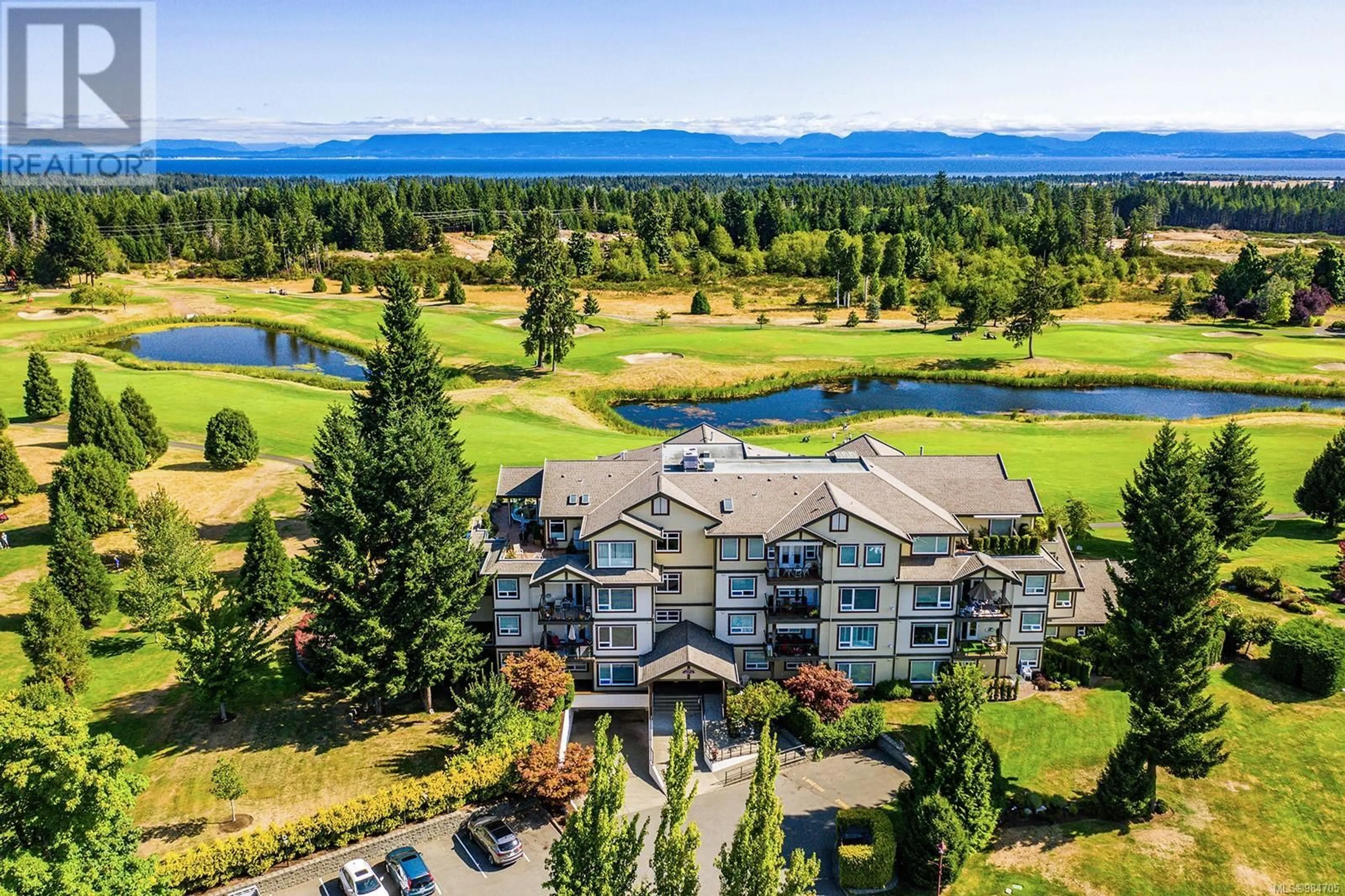 A pic from outside/outdoor area/front of a property/back of a property/a pic from drone, water/lake/river/ocean view for 226 3666 Royal Vista Way, Courtenay British Columbia V9N9X8