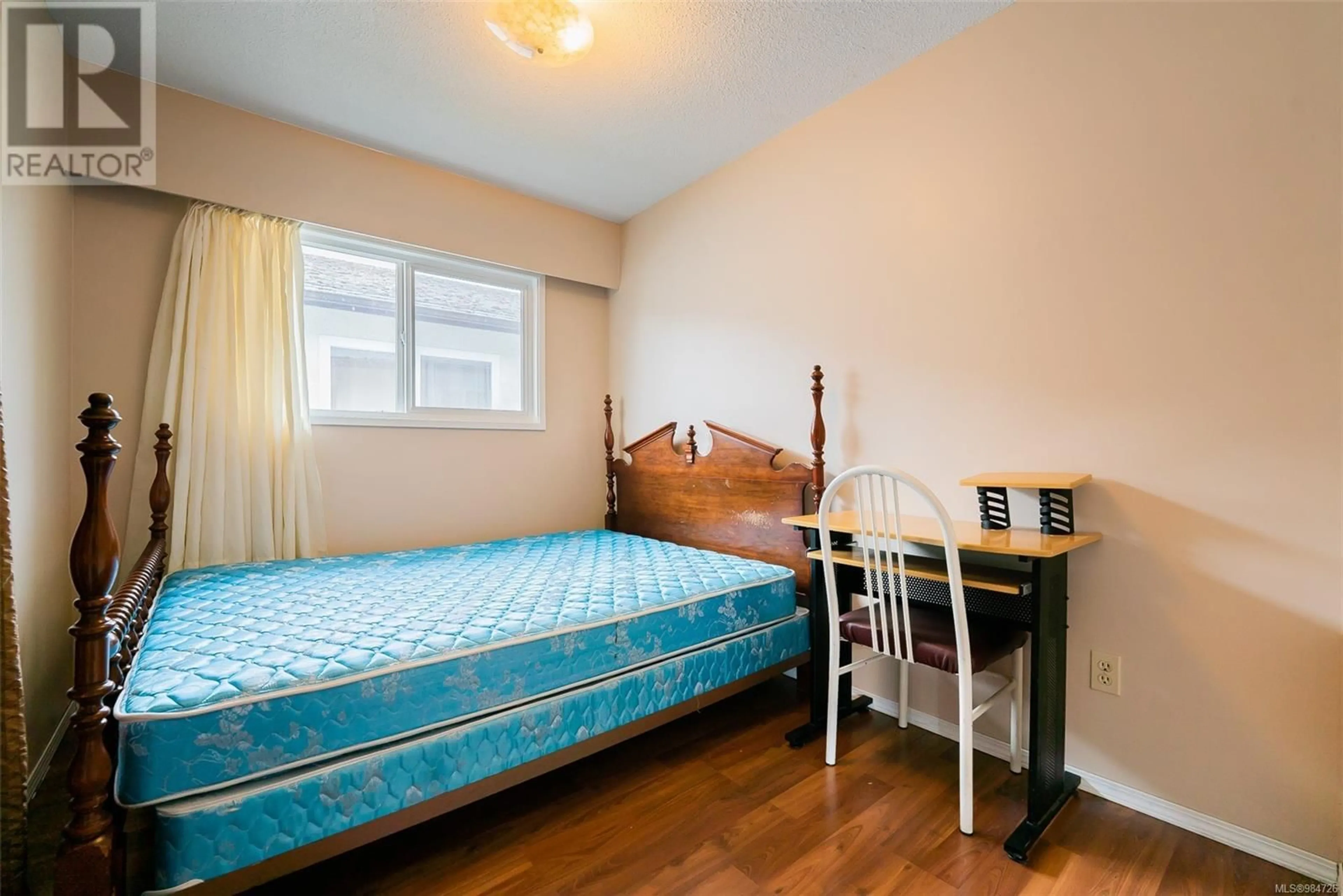 Bedroom with bed, wood/laminate floor for 540 Wakesiah Ave, Nanaimo British Columbia V9R3L1