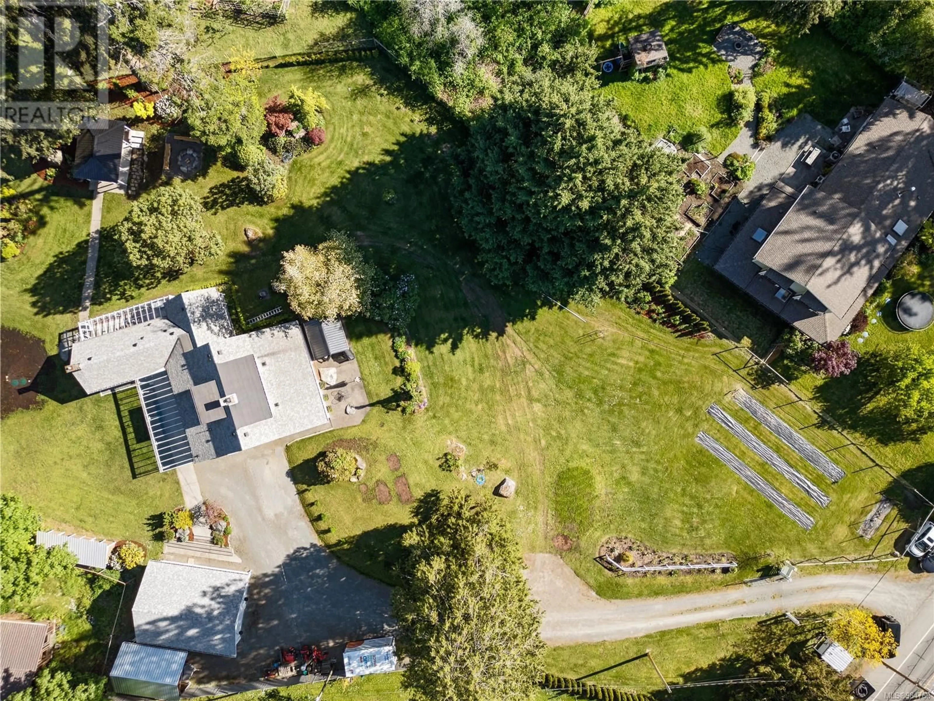 A pic from outside/outdoor area/front of a property/back of a property/a pic from drone, street for 1184 Maple Bay Rd, Duncan British Columbia V9L5X1