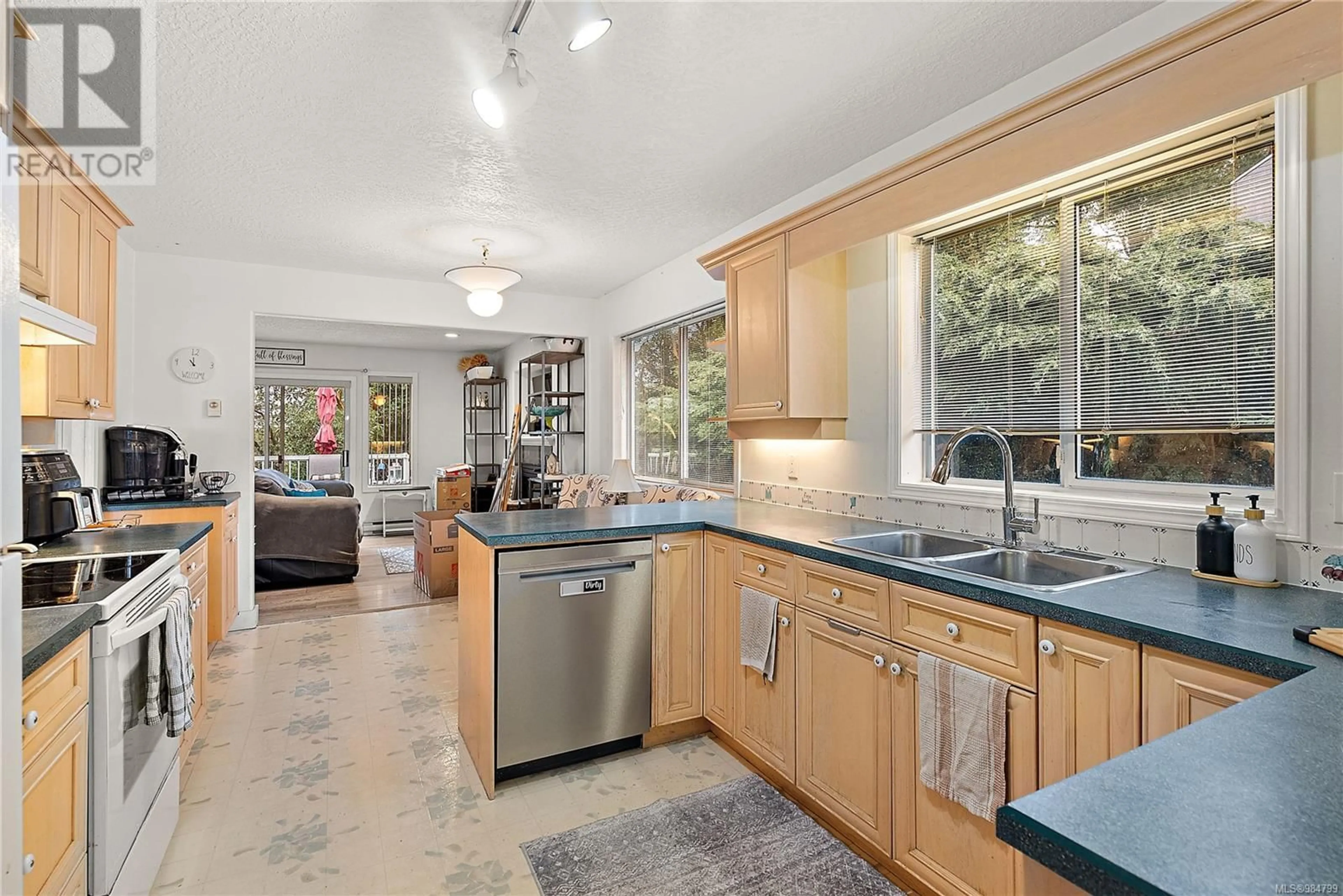 Open concept kitchen, ceramic/tile floor for 1116 Monica Terr, Langford British Columbia V9C3V2