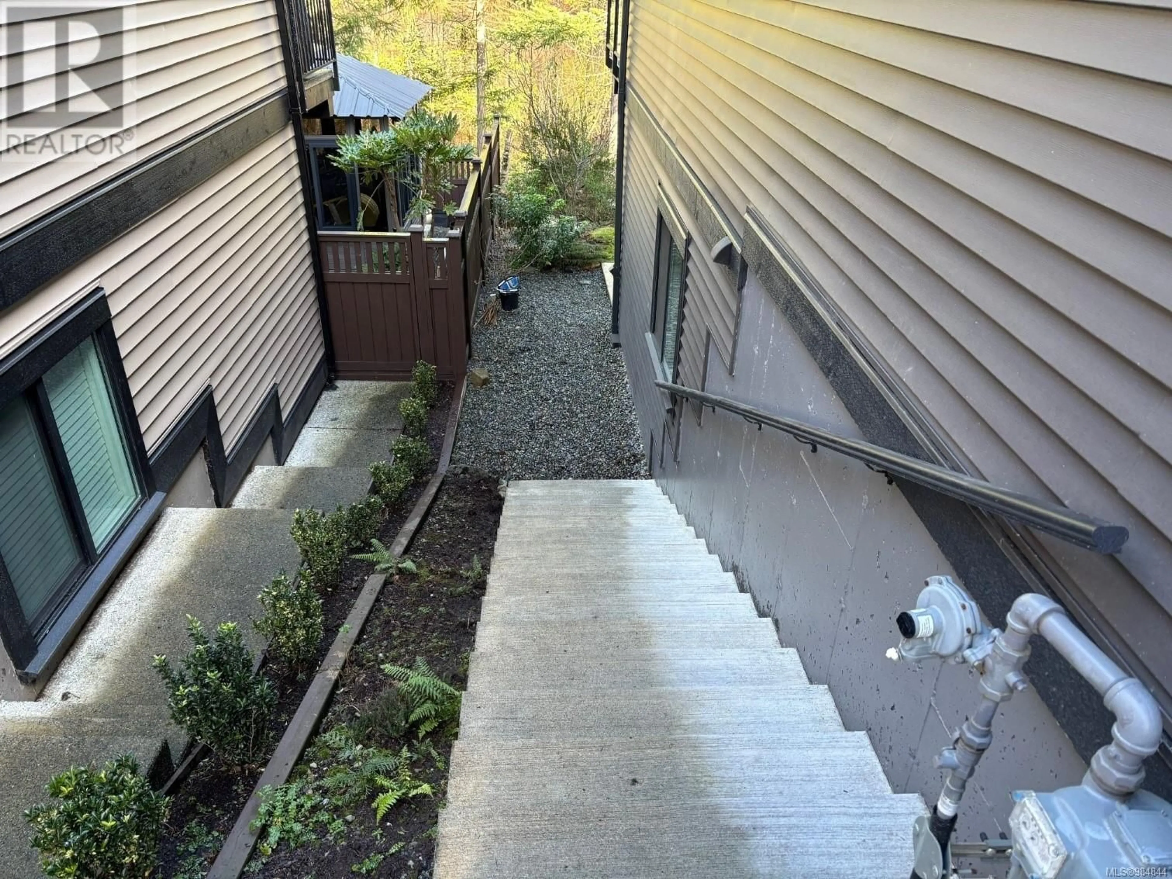 A pic from outside/outdoor area/front of a property/back of a property/a pic from drone, street for 5938 Stillwater Way, Nanaimo British Columbia V9T0J6