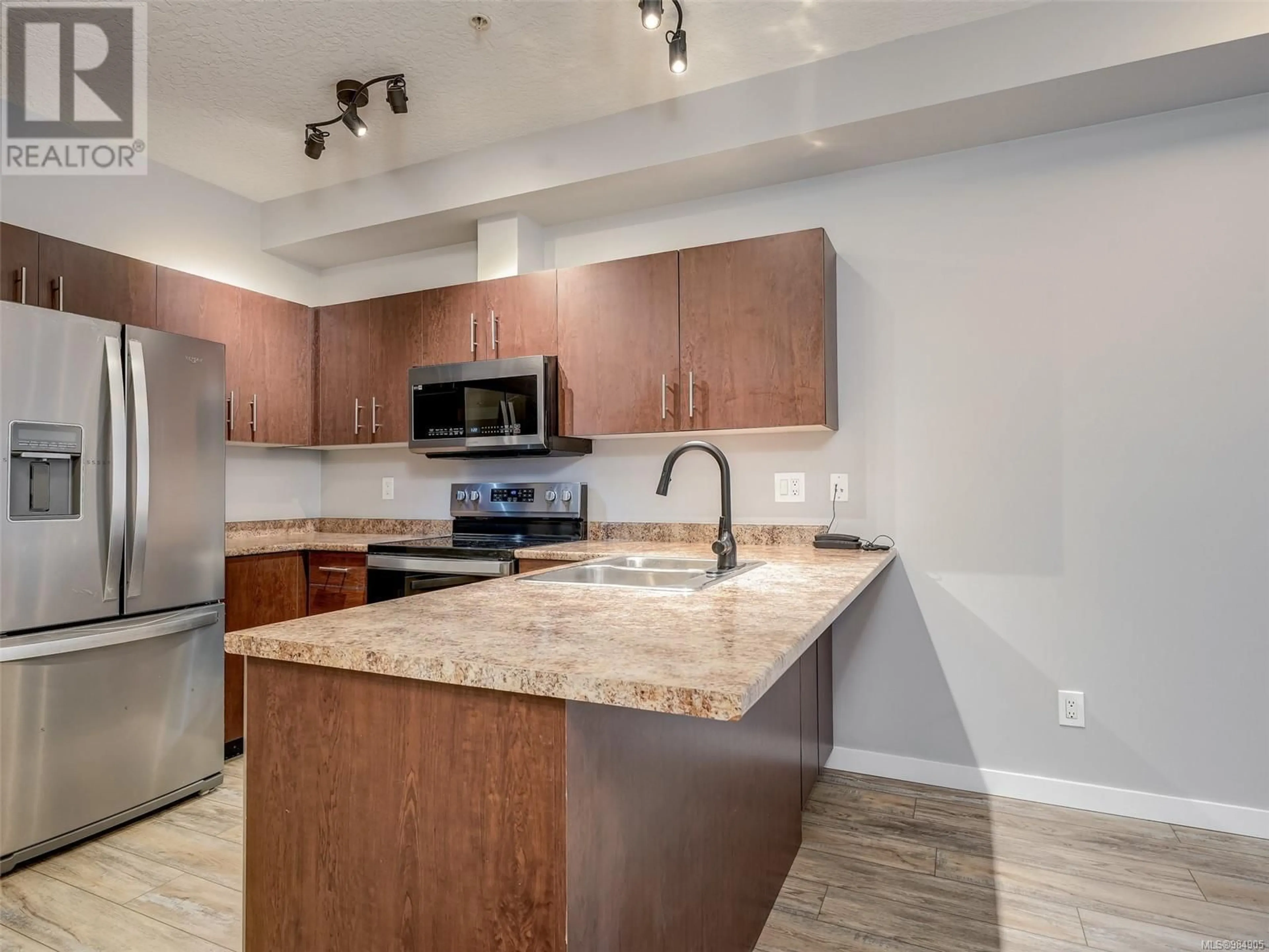 Open concept kitchen, unknown for 208 825 Goldstream Ave, Langford British Columbia V9C0C3