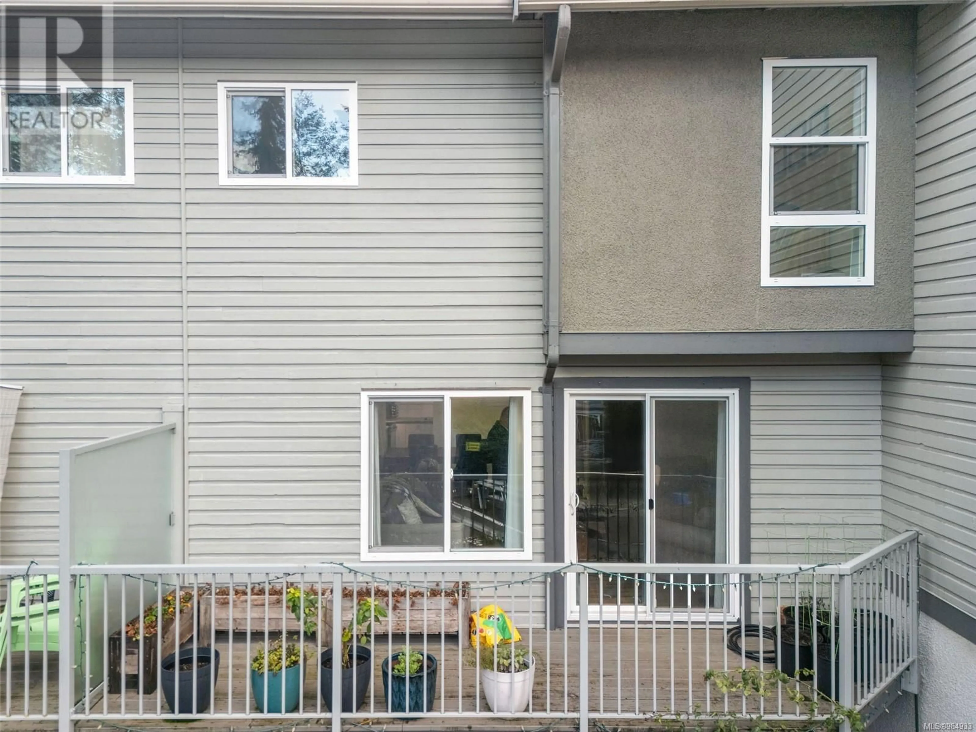 Home with vinyl exterior material, street for 594 Carnation Pl, Saanich British Columbia V8Z6G5