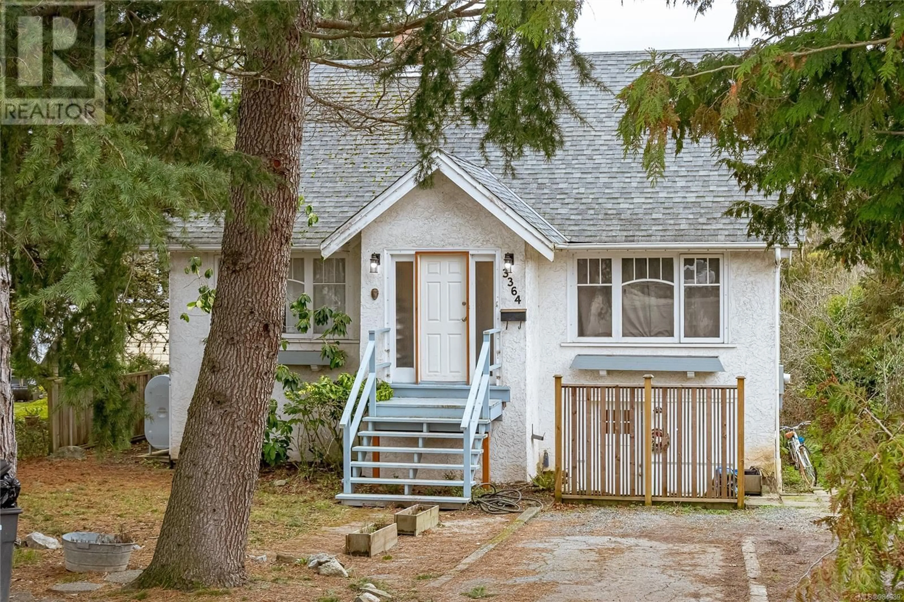 Home with vinyl exterior material, street for 3364 Cook St, Saanich British Columbia V8X1A8