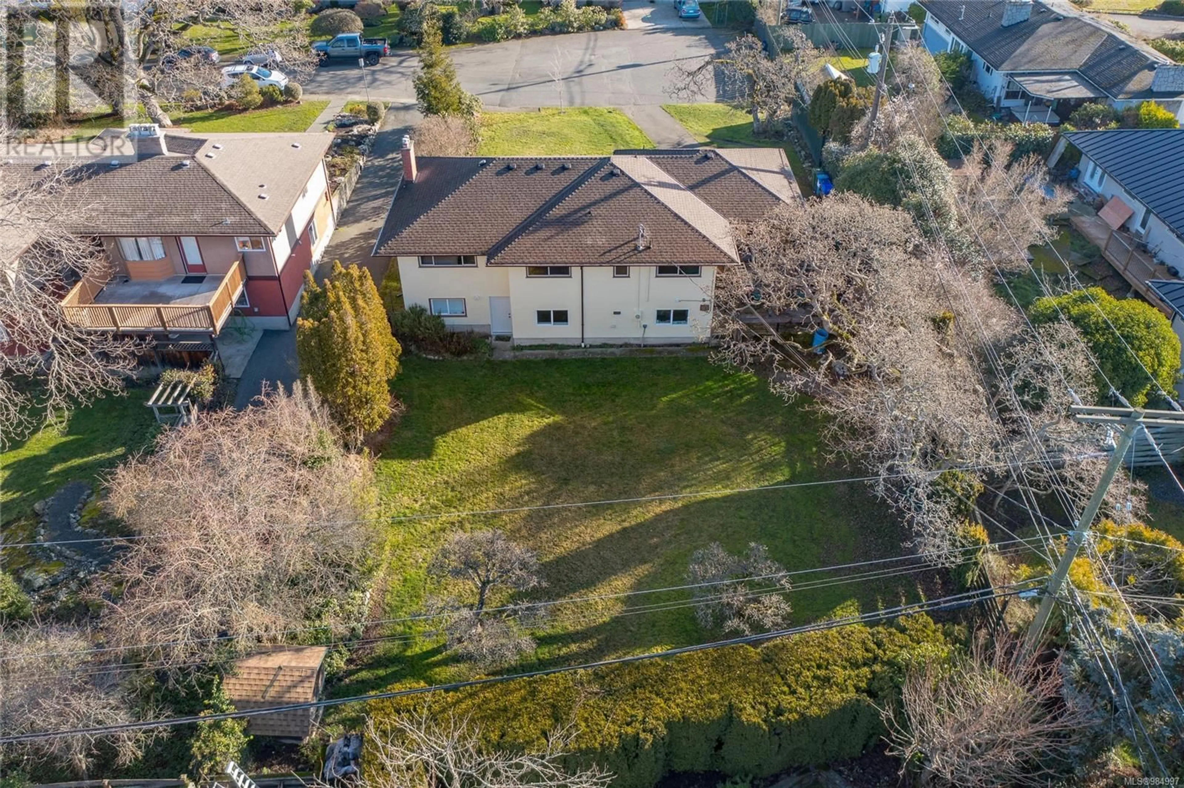 A pic from outside/outdoor area/front of a property/back of a property/a pic from drone, street for 3100 Woodburn Ave, Oak Bay British Columbia V8P5B7