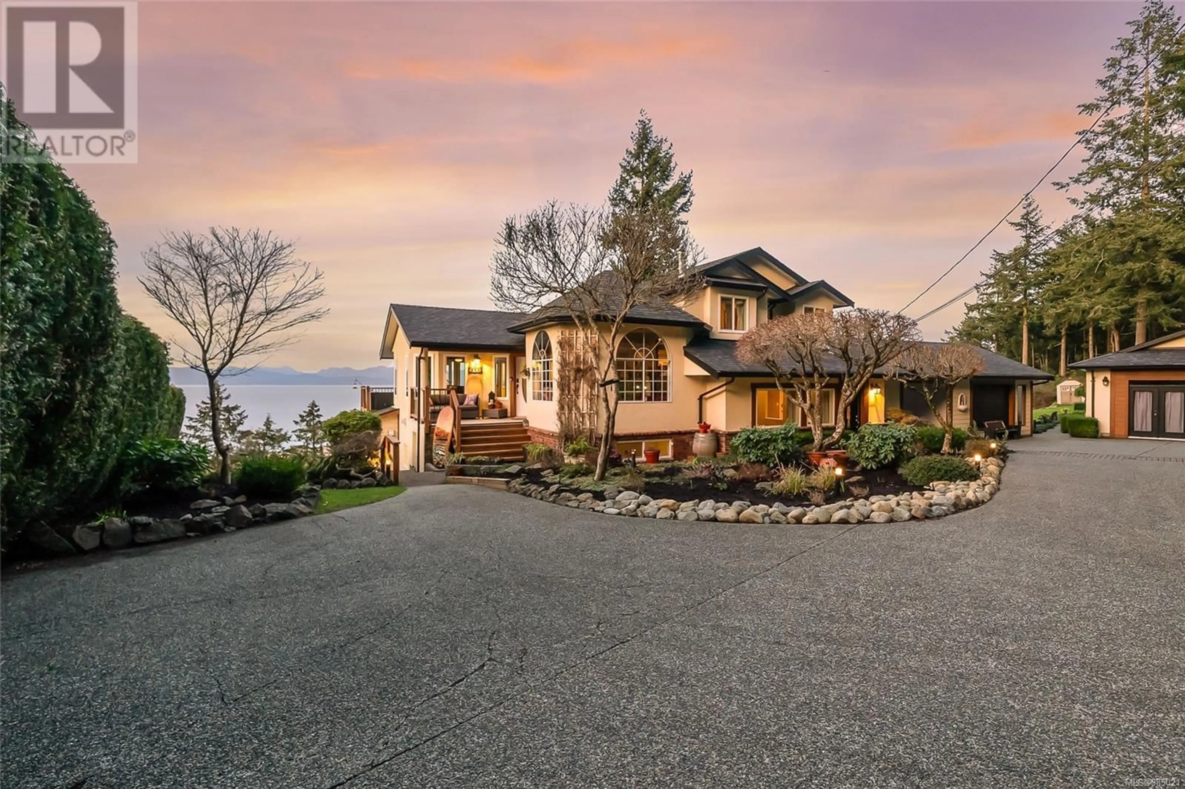 A pic from outside/outdoor area/front of a property/back of a property/a pic from drone, street for 5060 LOST LAKE ROAD, Nanaimo British Columbia V9T5E4