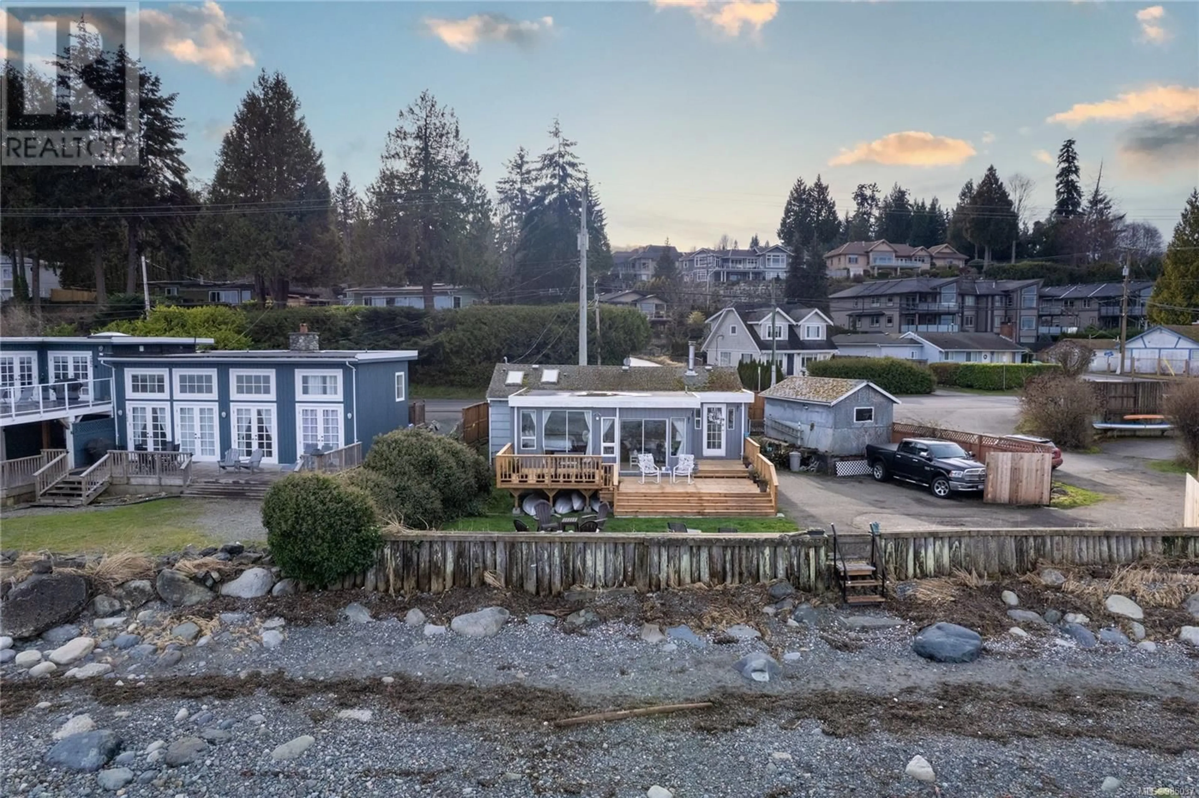 A pic from outside/outdoor area/front of a property/back of a property/a pic from drone, water/lake/river/ocean view for 3257 Island Hwy, Qualicum Beach British Columbia V9K2C6