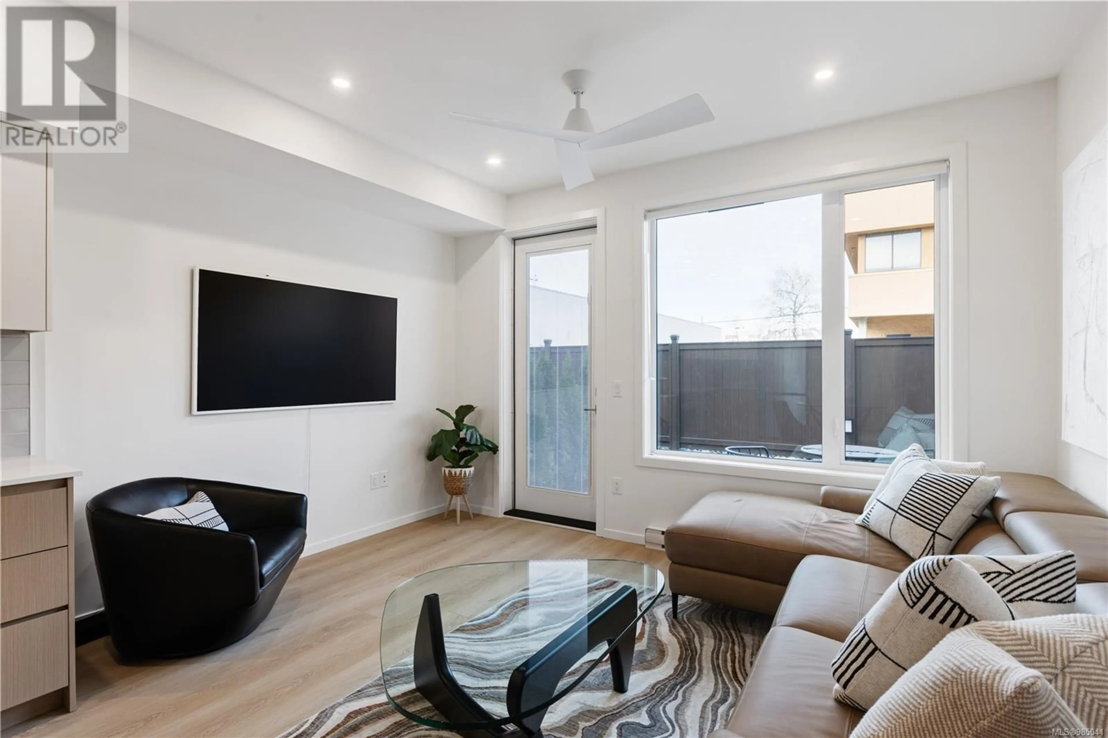 Living room with furniture, wood/laminate floor for 106 2374 Oakville Ave, Sidney British Columbia V8L1V5