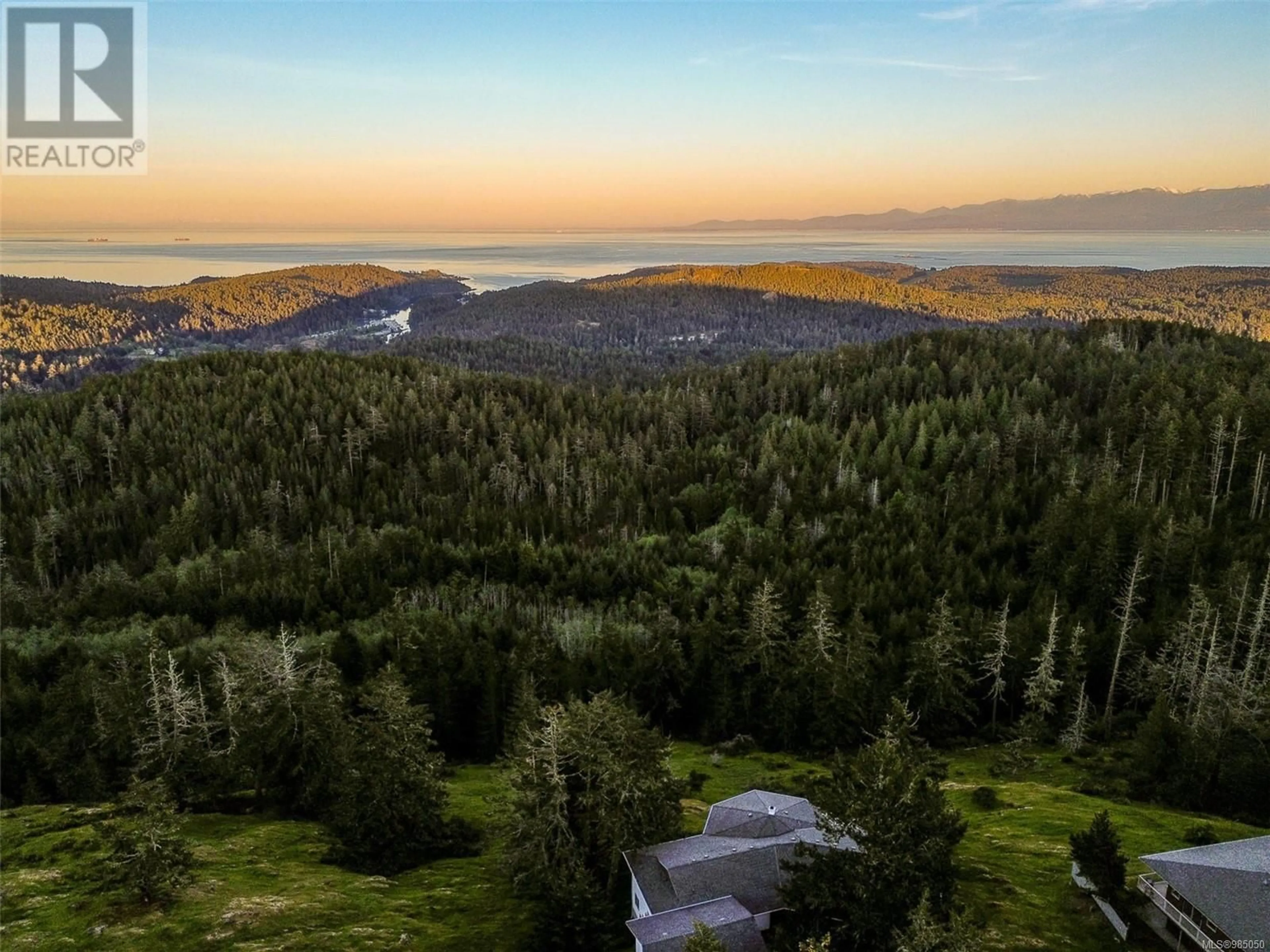 A pic from outside/outdoor area/front of a property/back of a property/a pic from drone, forest/trees view for 681 Cains Way, Sooke British Columbia V9Z1C6