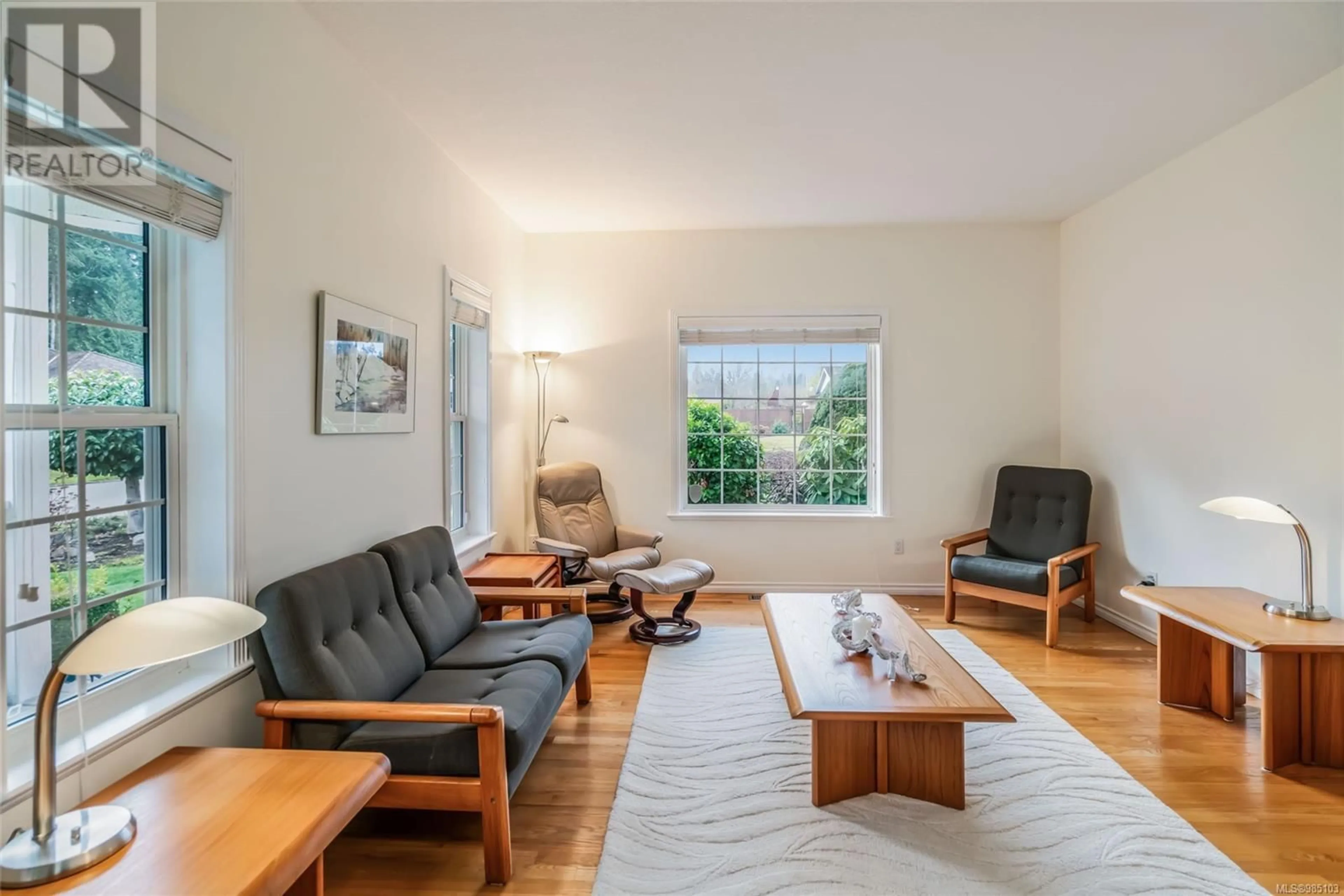 Living room with furniture, wood/laminate floor for 819 Tribune Pl, Qualicum Beach British Columbia V9K2P1