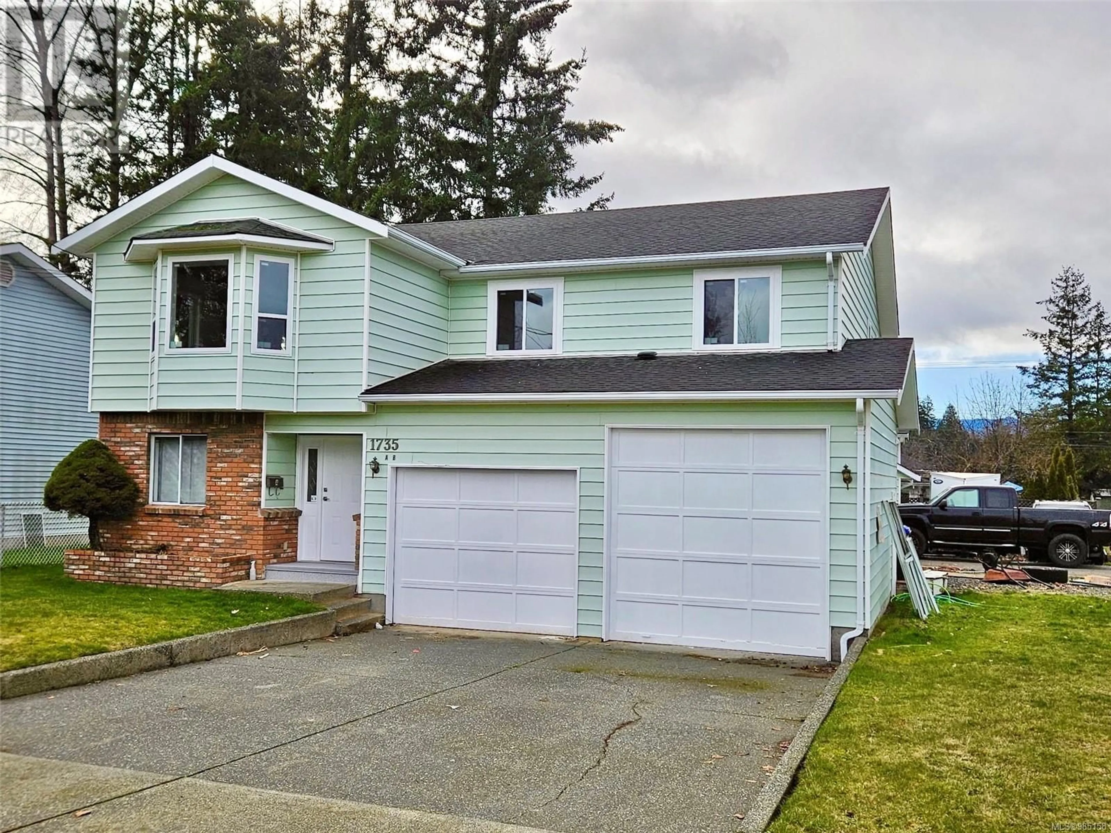 Home with vinyl exterior material, street for 1735 Urquhart Ave, Courtenay British Columbia V9N6W5