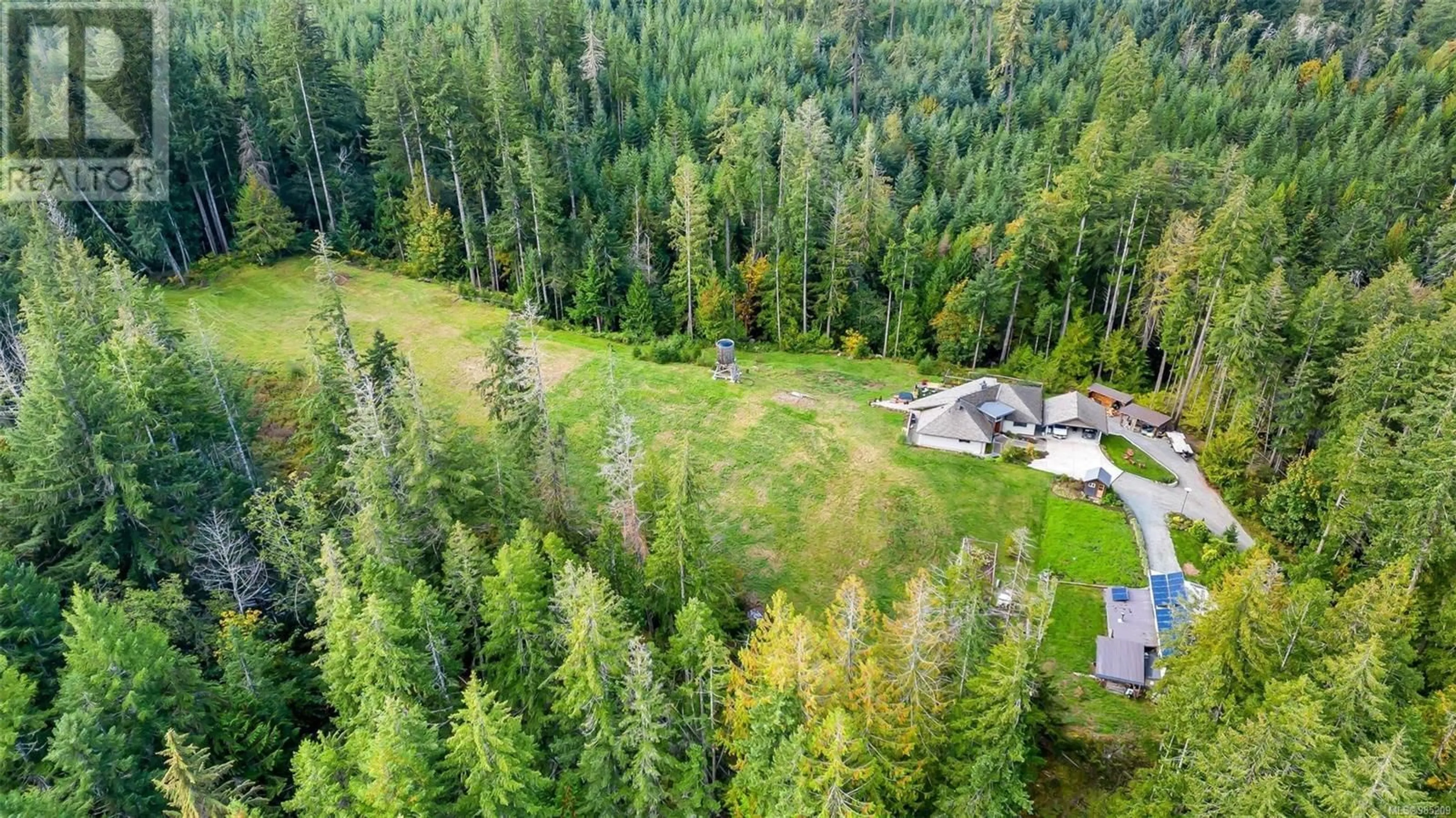 A pic from outside/outdoor area/front of a property/back of a property/a pic from drone, forest/trees view for 3272 Renfrew Rd, Shawnigan Lake British Columbia V0R2W0