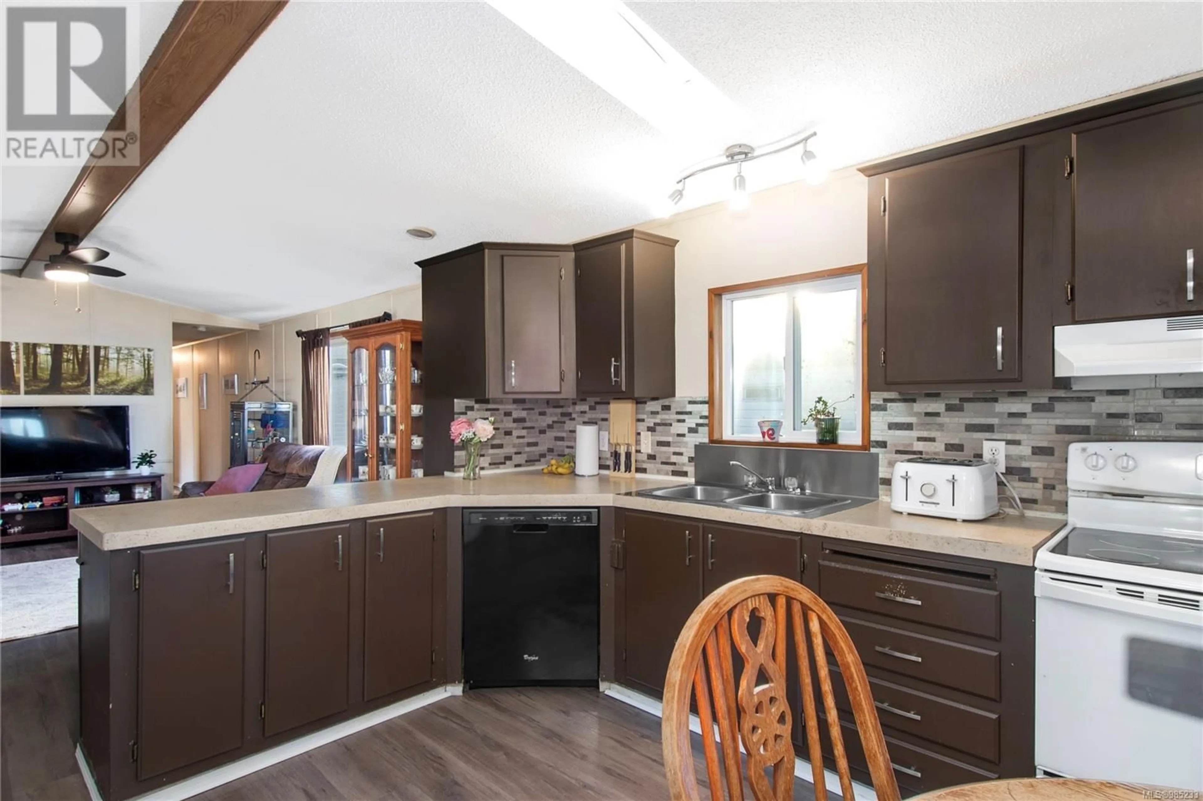 Open concept kitchen, wood/laminate floor for 41 2520 Quinsam Rd, Campbell River British Columbia V9W4N4