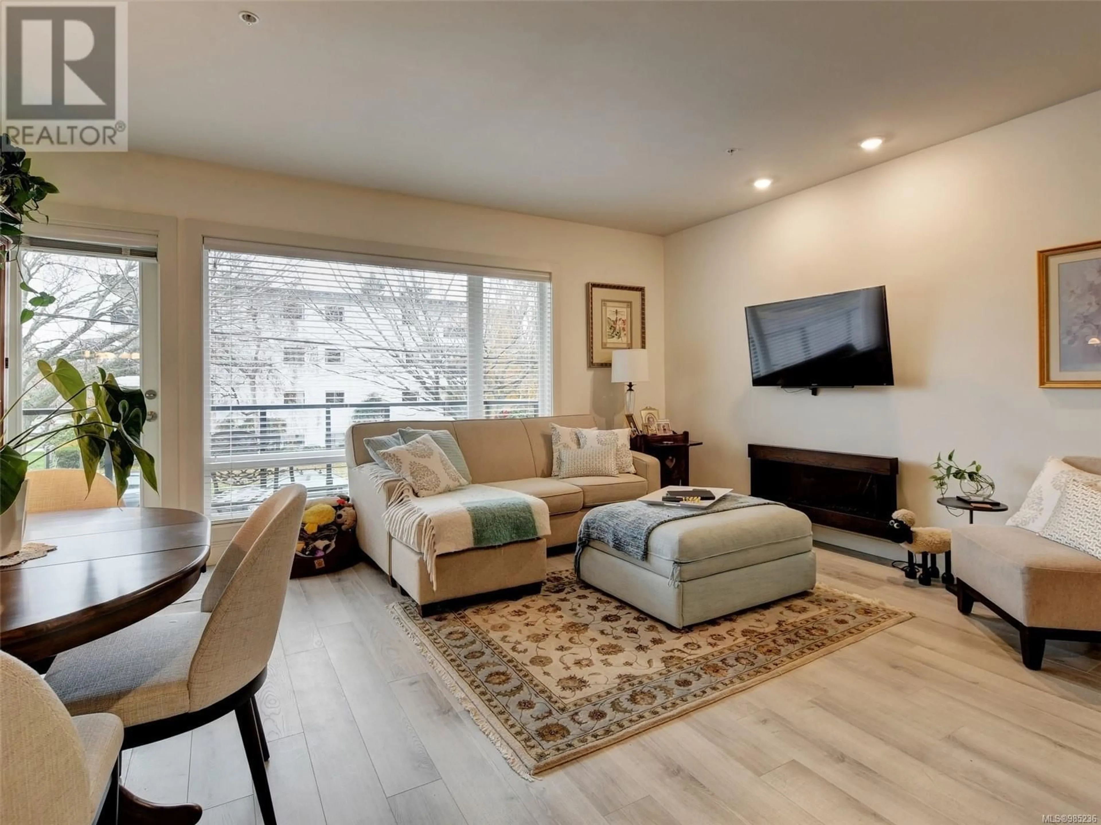 Living room with furniture, wood/laminate floor for 202 300 Michigan St, Victoria British Columbia V8V1R5