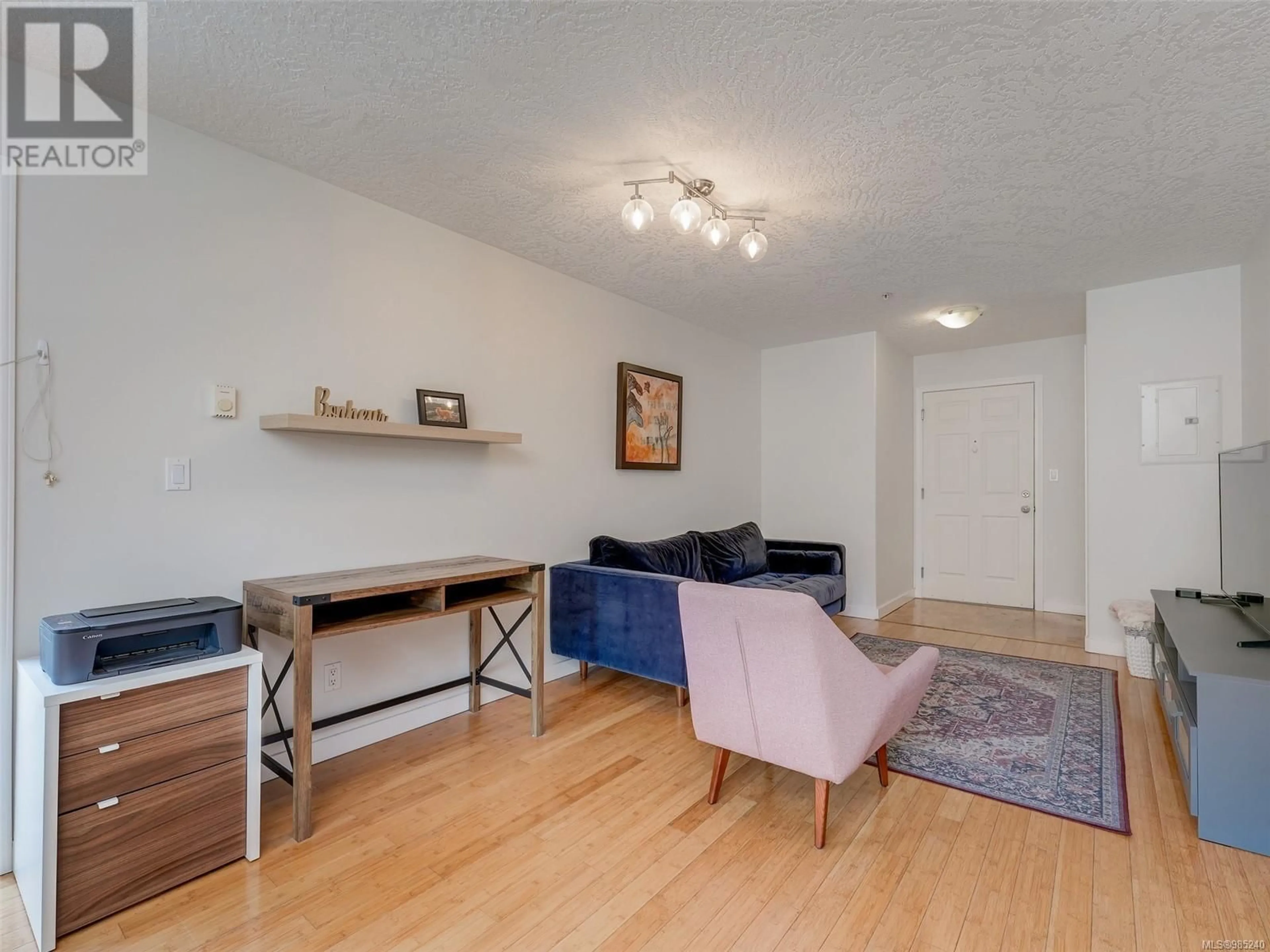 Living room with furniture, wood/laminate floor for 403 885 Ellery St, Esquimalt British Columbia V9A4R8