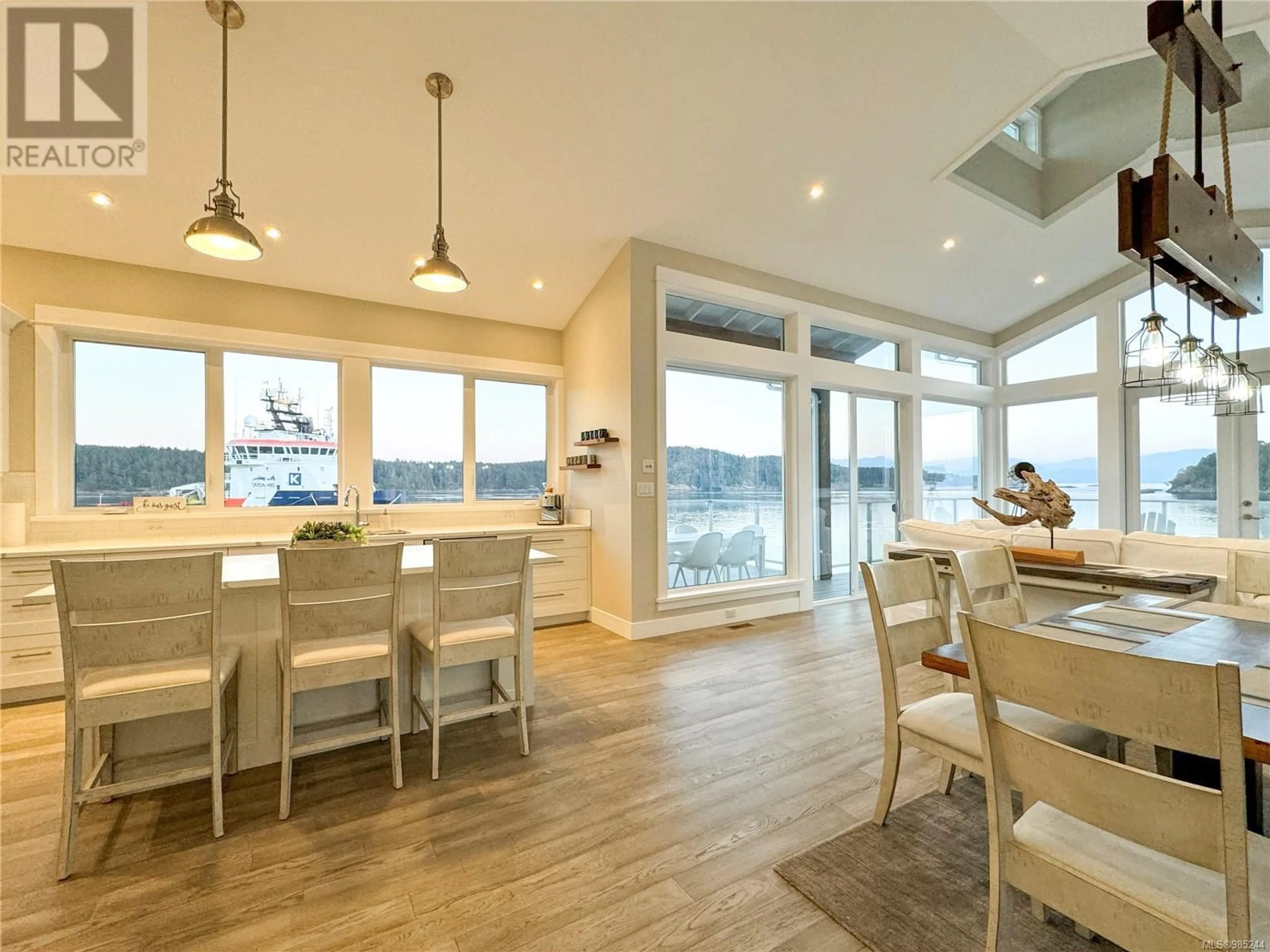 Open concept kitchen, wood/laminate floor for 812 Sunset Pt, Sooke British Columbia V9Z1N6