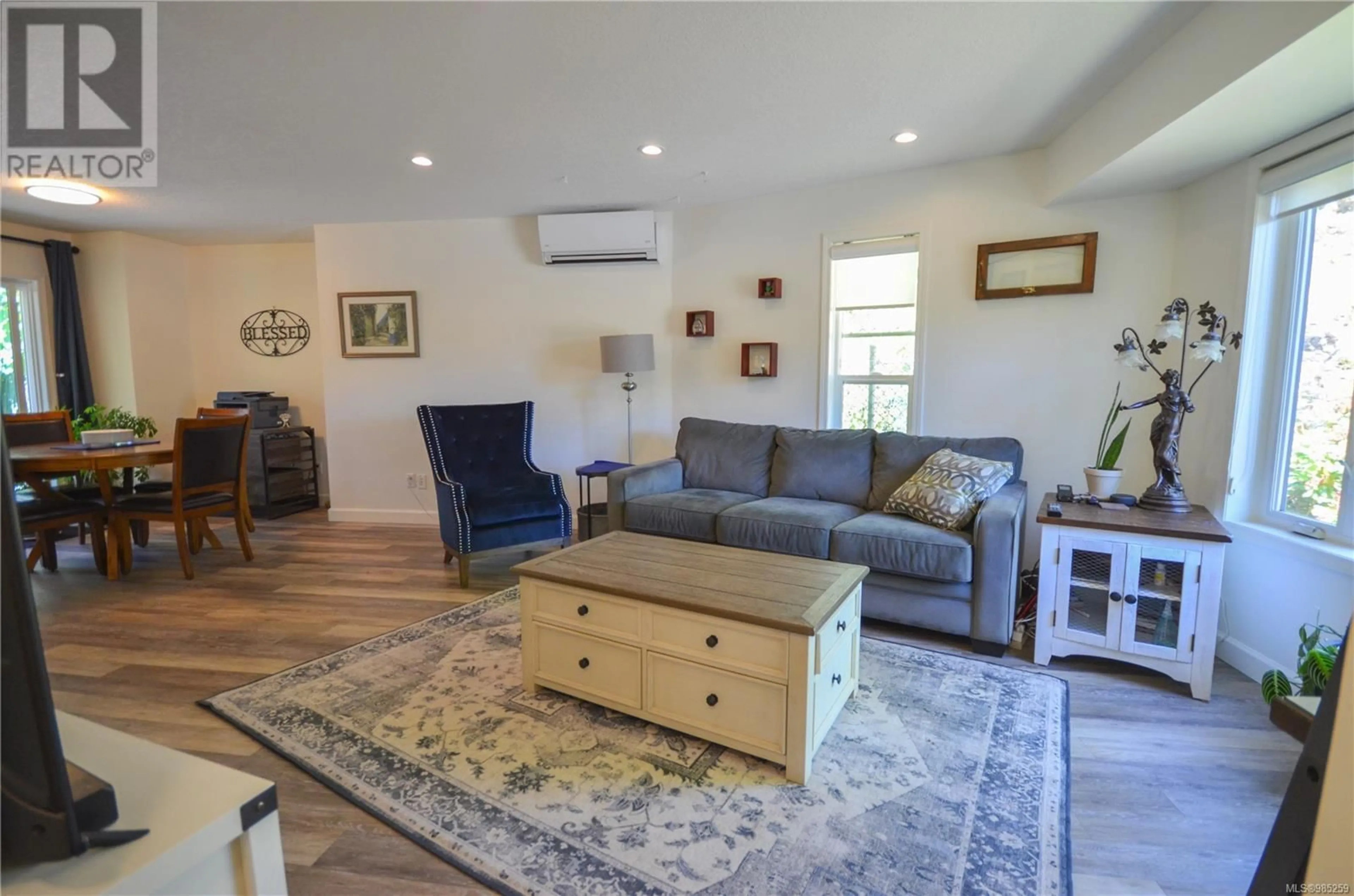 Living room with furniture, wood/laminate floor for 3231 Greystone Pl, Nanaimo British Columbia V9T5S2