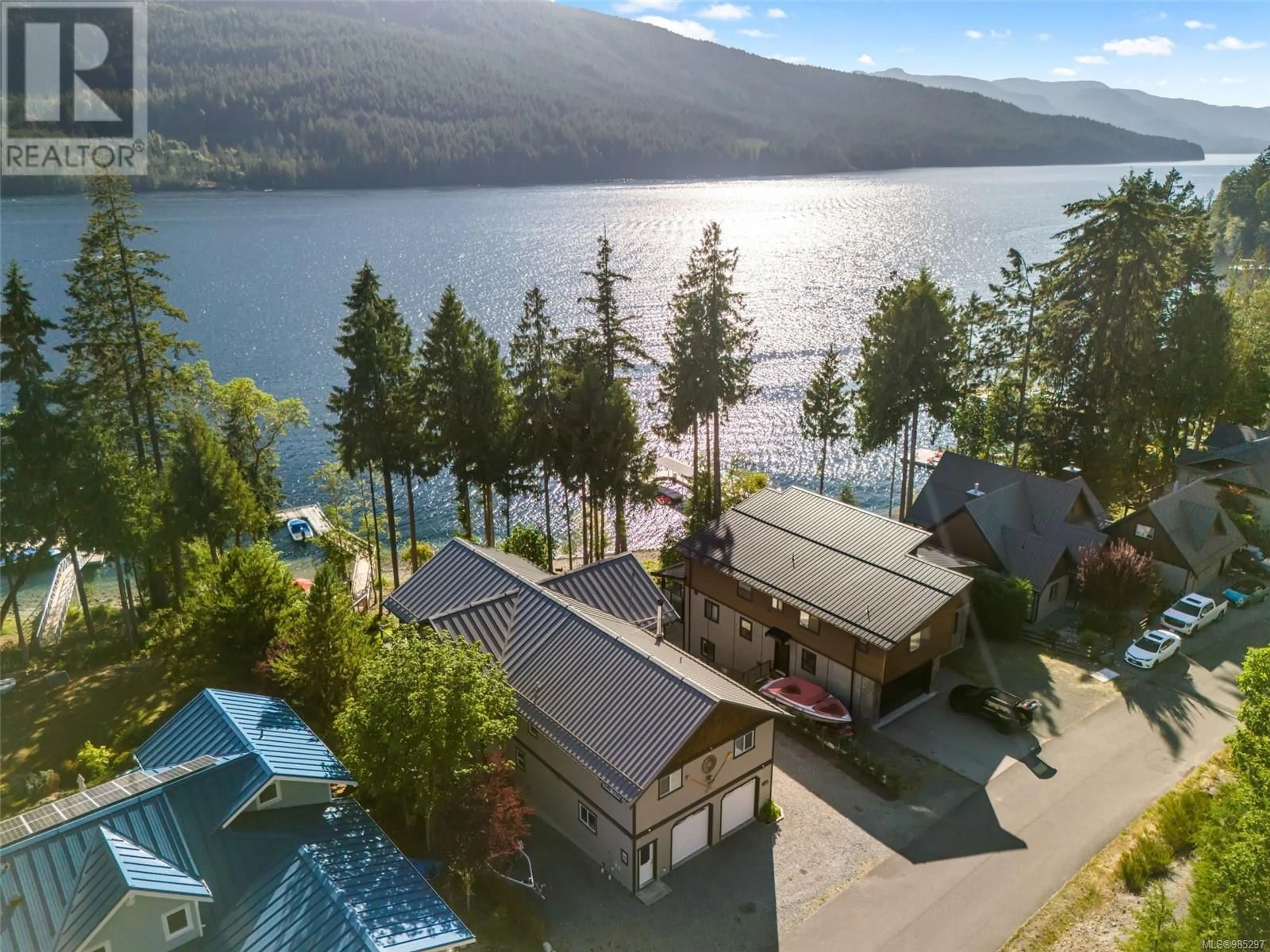 A pic from outside/outdoor area/front of a property/back of a property/a pic from drone, water/lake/river/ocean view for 9380 Creekside Dr, Youbou British Columbia V0R3E1