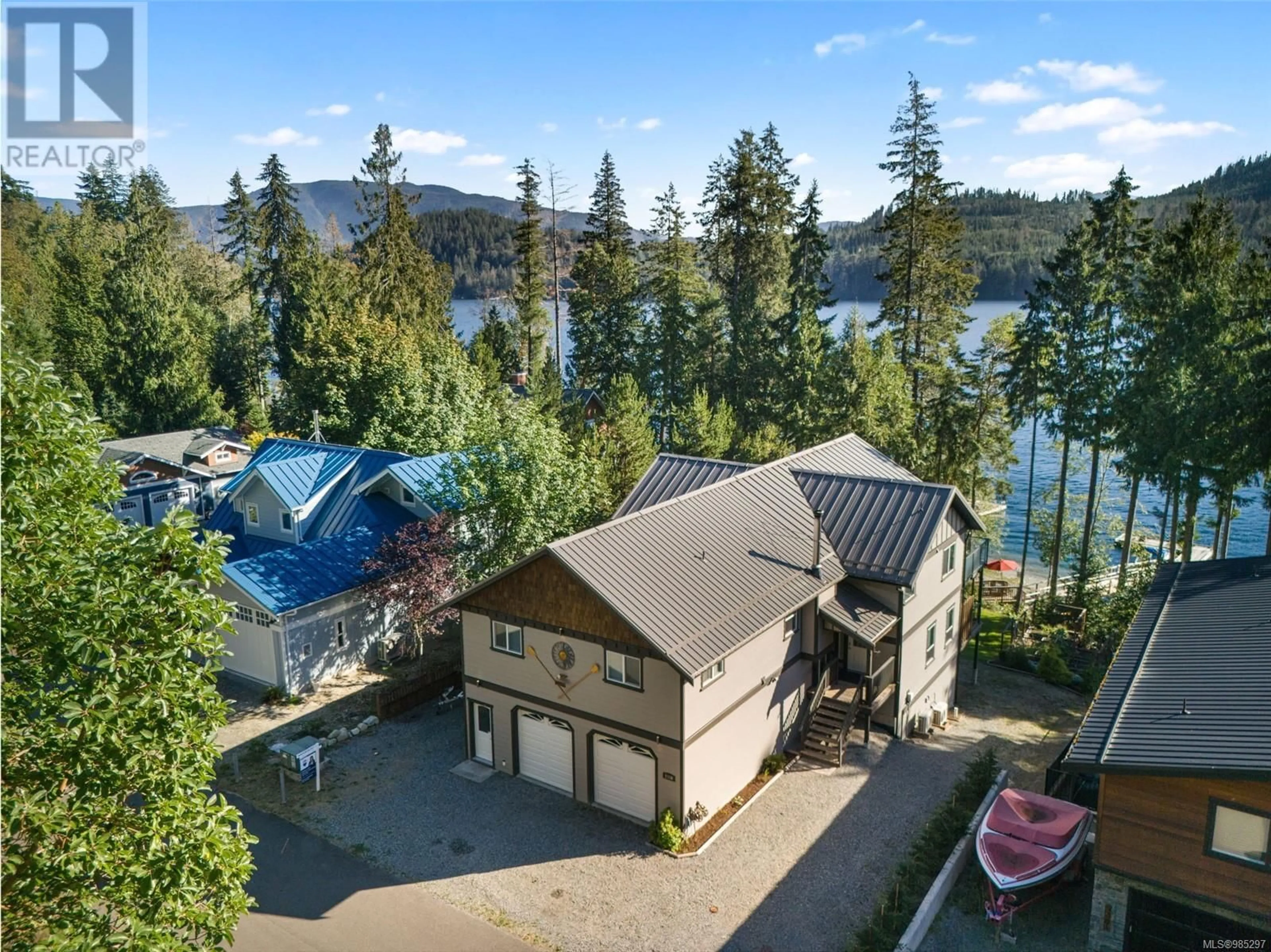 A pic from outside/outdoor area/front of a property/back of a property/a pic from drone, water/lake/river/ocean view for 9380 Creekside Dr, Youbou British Columbia V0R3E1