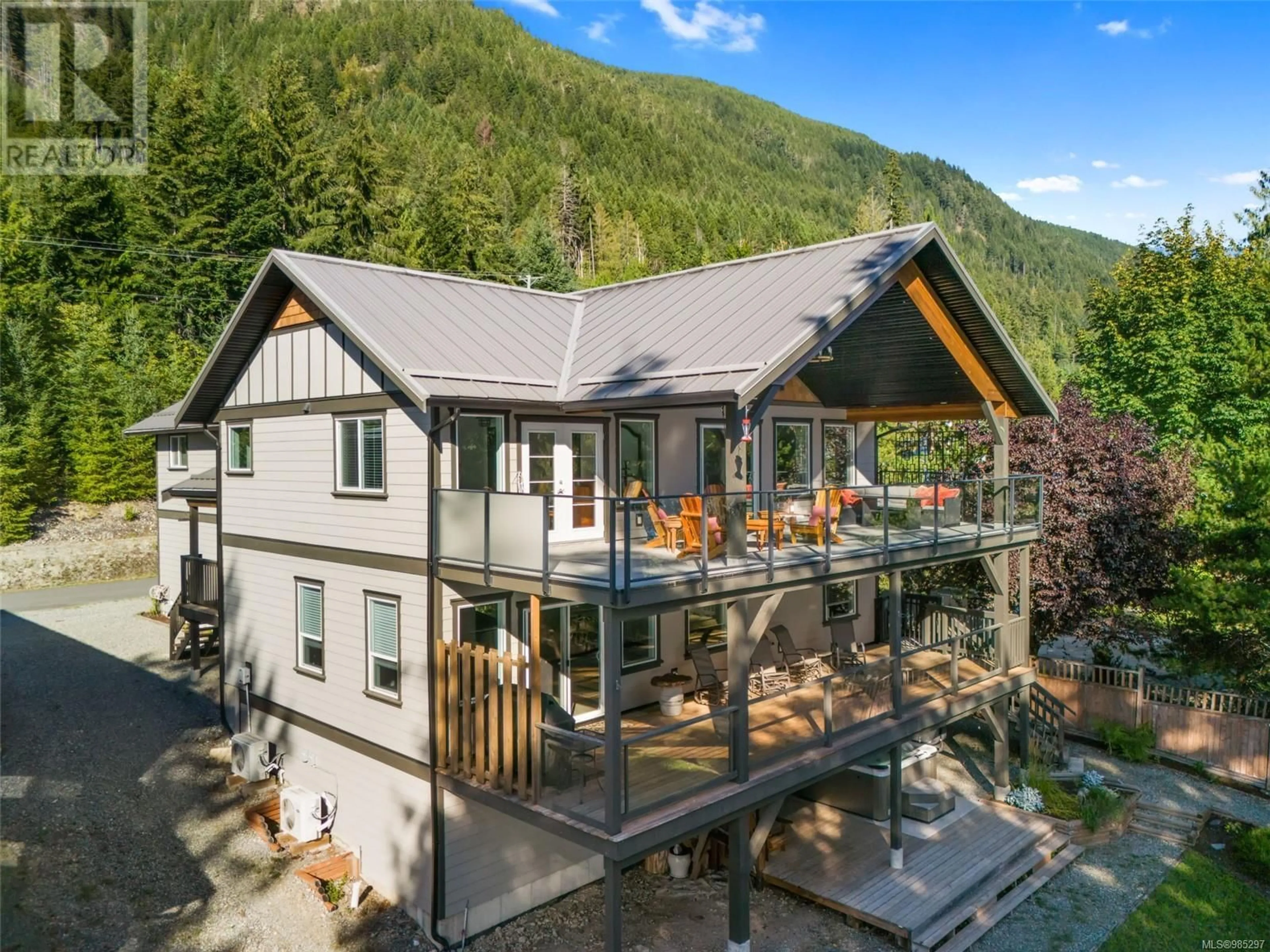 A pic from outside/outdoor area/front of a property/back of a property/a pic from drone, mountain view for 9380 Creekside Dr, Youbou British Columbia V0R3E1