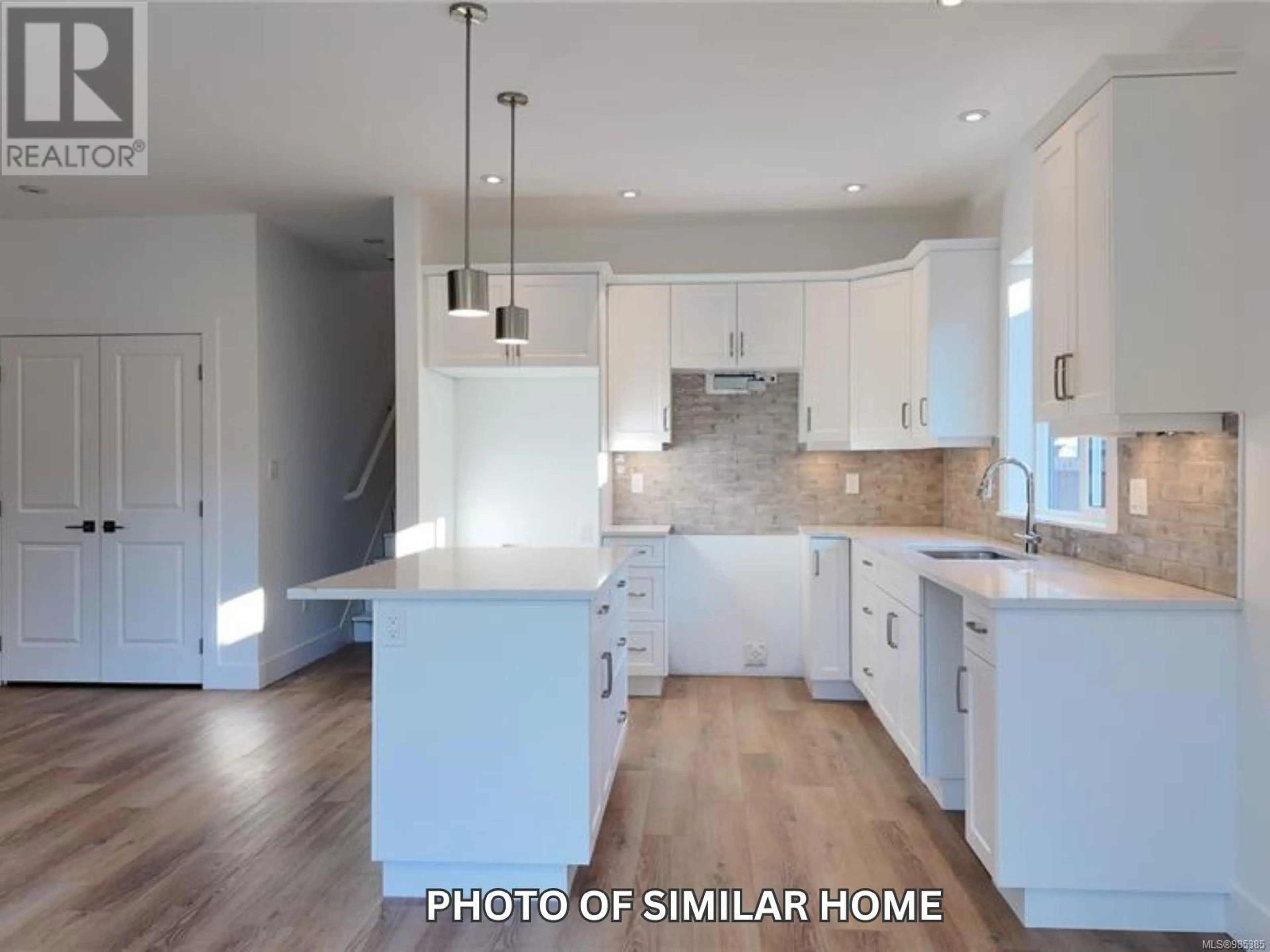 Open concept kitchen, wood/laminate floor for 3054 Abbott Pl, Chemainus British Columbia V9L3X1