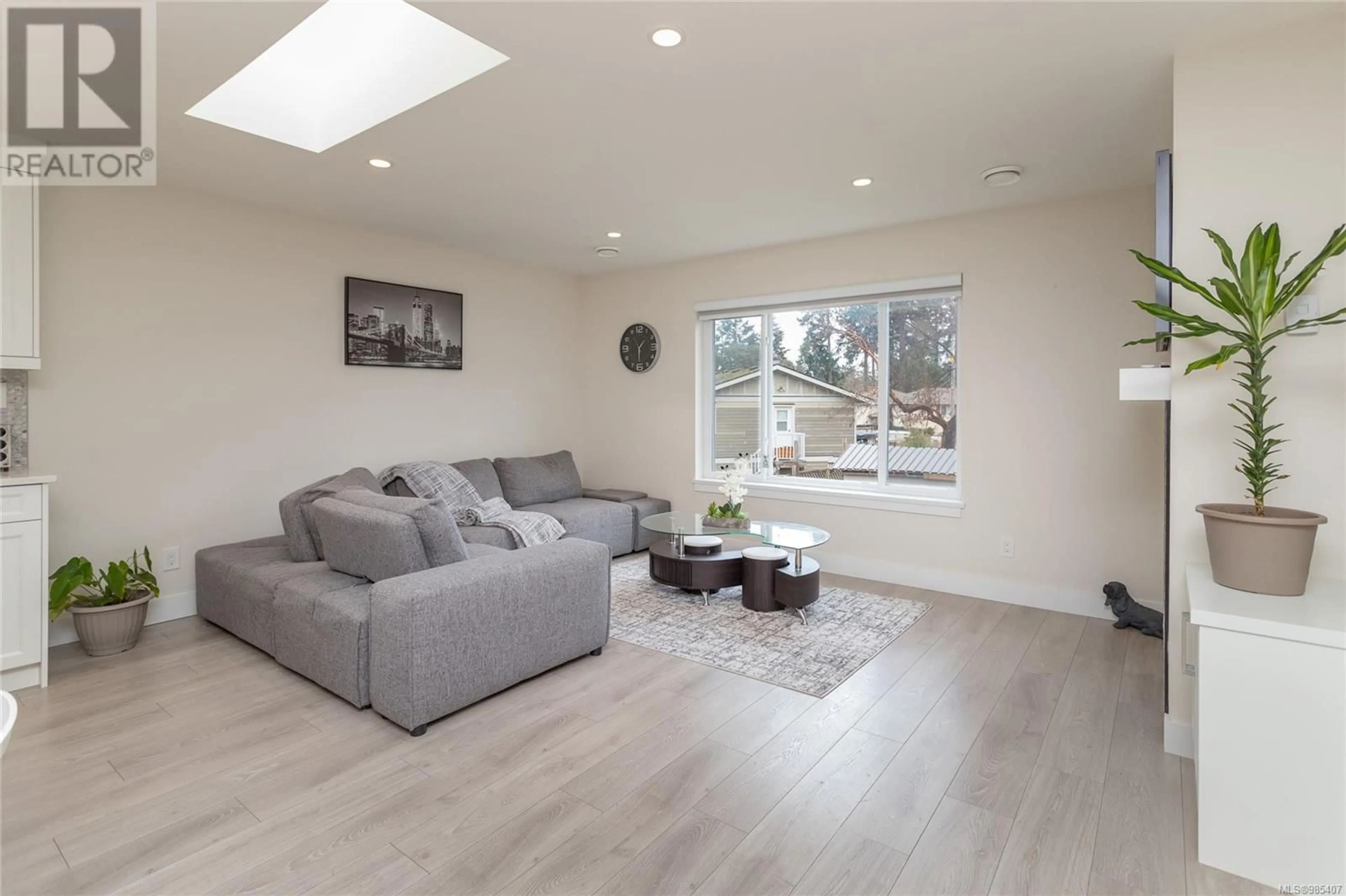 Living room with furniture, wood/laminate floor for 3017 Zen Lane, Colwood British Columbia V9B2A1