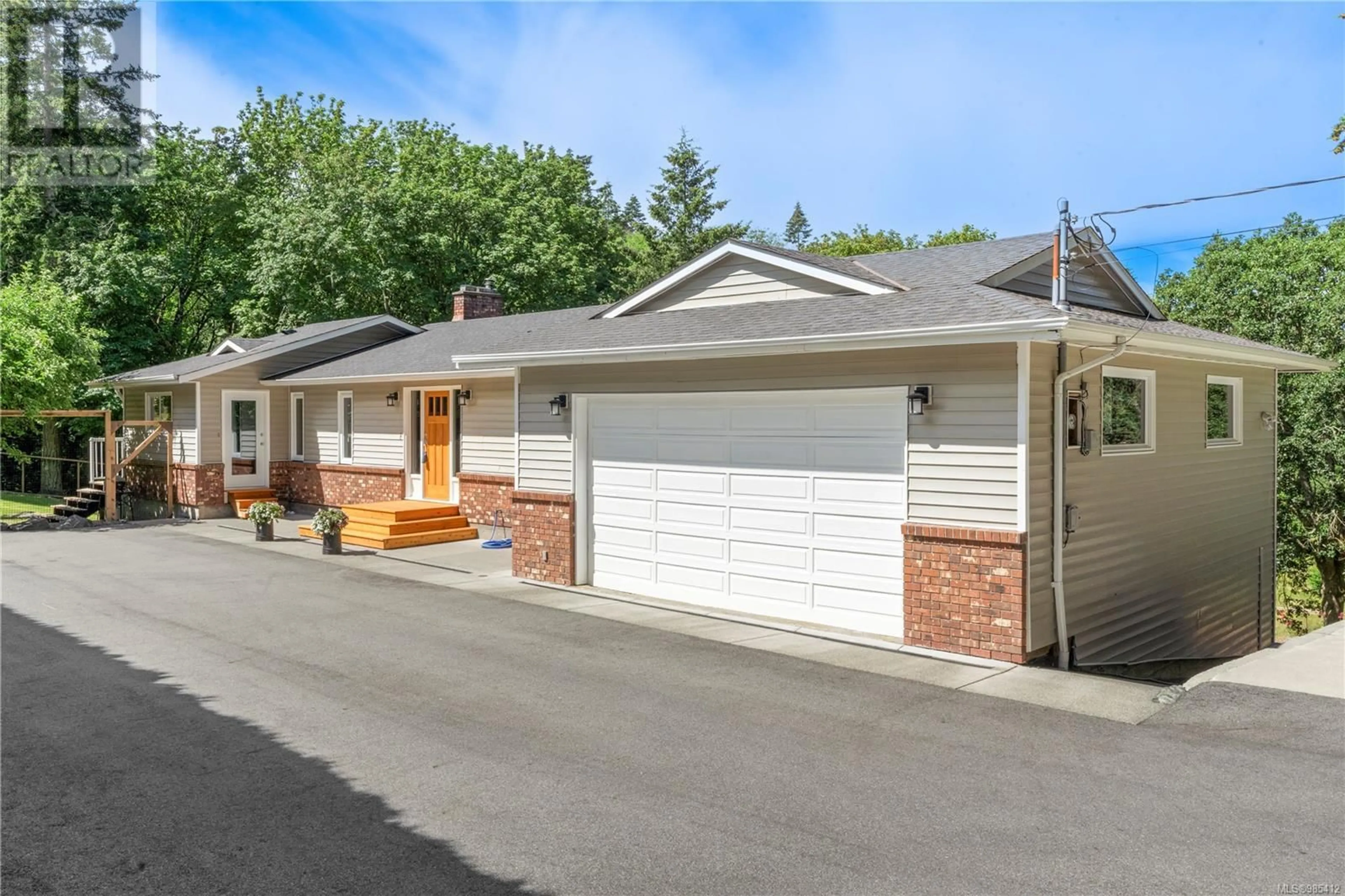 Home with vinyl exterior material, street for 1751 Cultra Ave, Central Saanich British Columbia V8M1T1