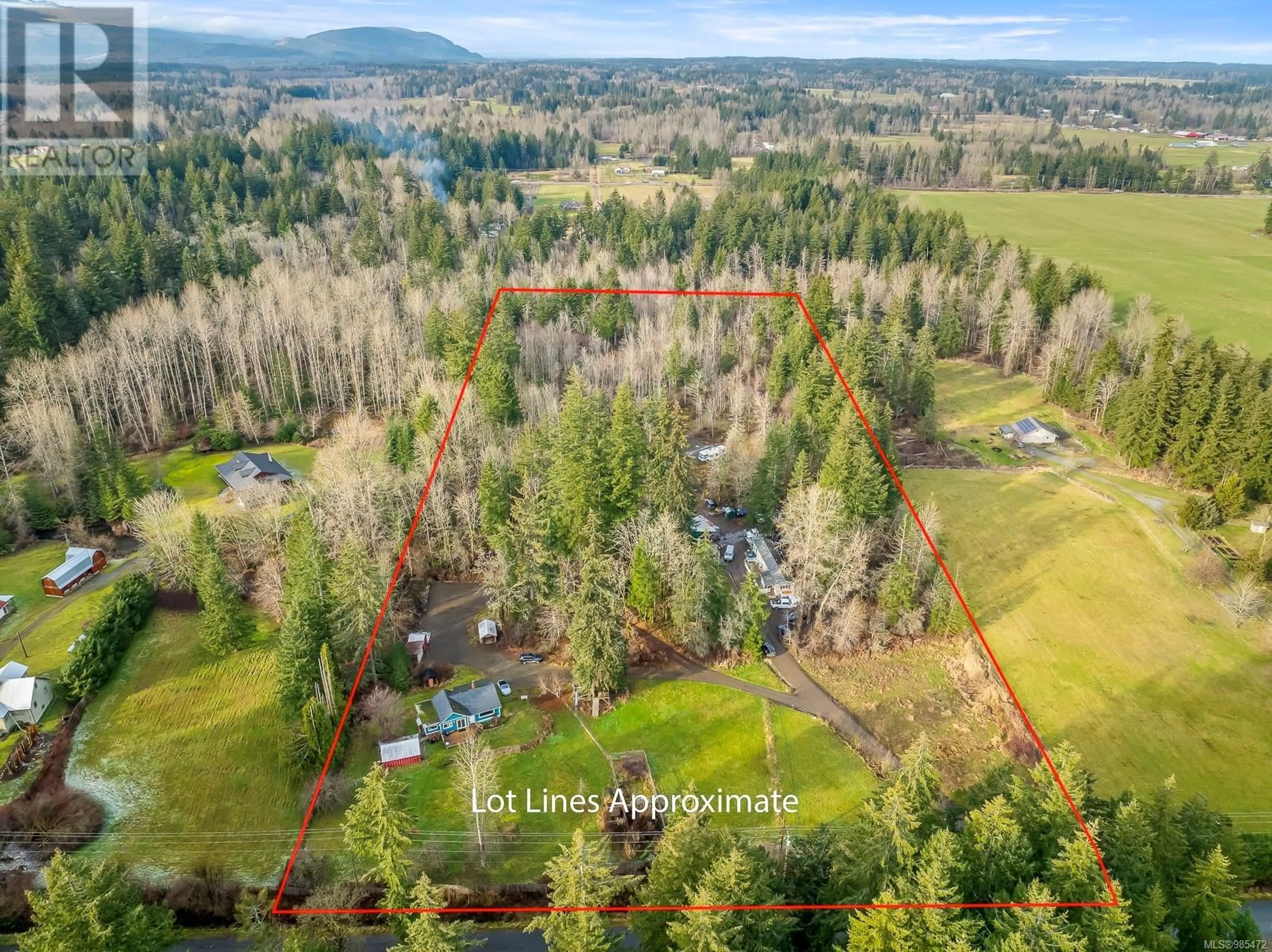 A pic from outside/outdoor area/front of a property/back of a property/a pic from drone, forest/trees view for 3388 Cessford Rd, Courtenay British Columbia V9J1R6