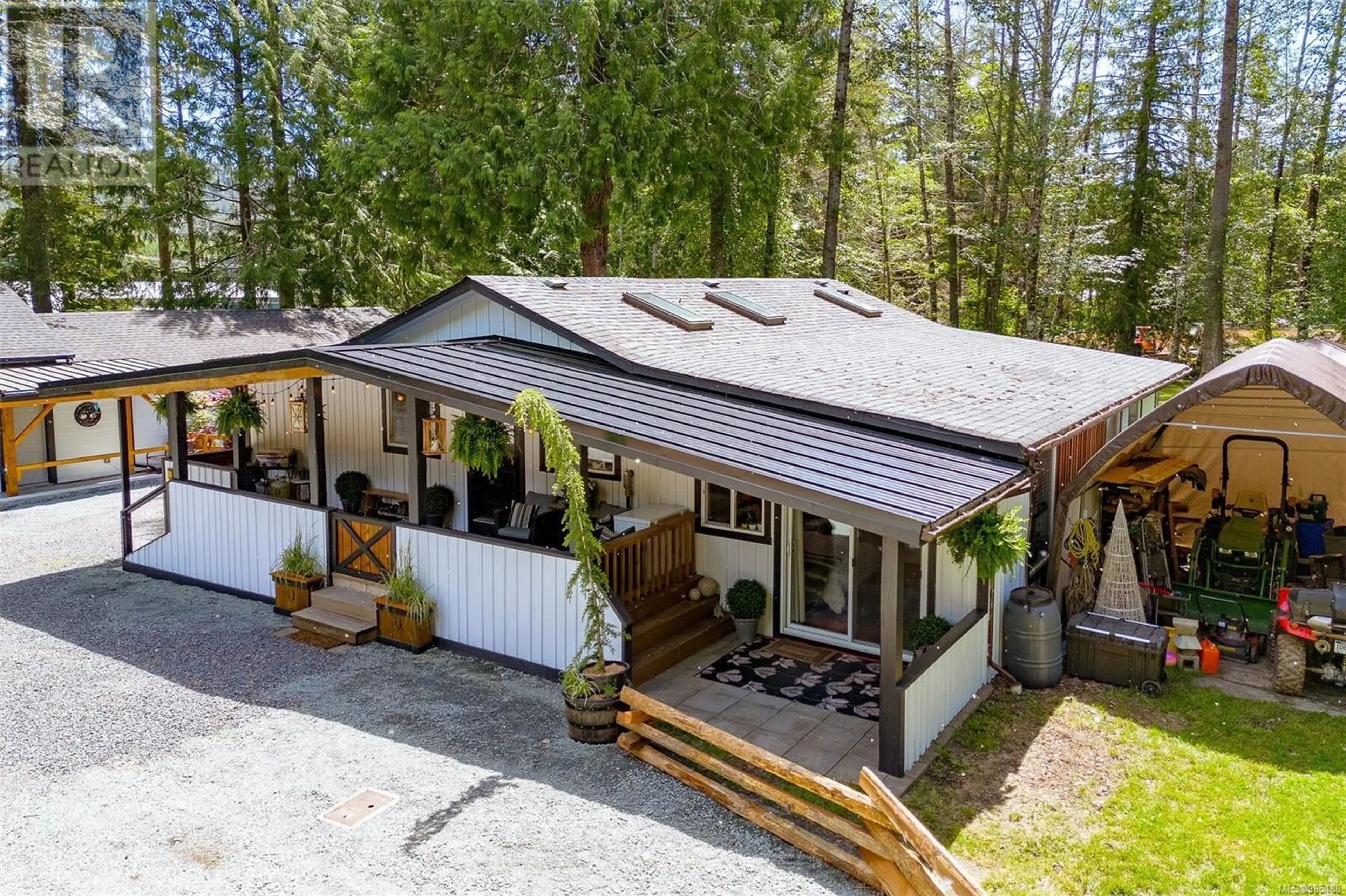 A pic from outside/outdoor area/front of a property/back of a property/a pic from drone, street for 3412 Otter Point Rd, Sooke British Columbia V9Z0J9