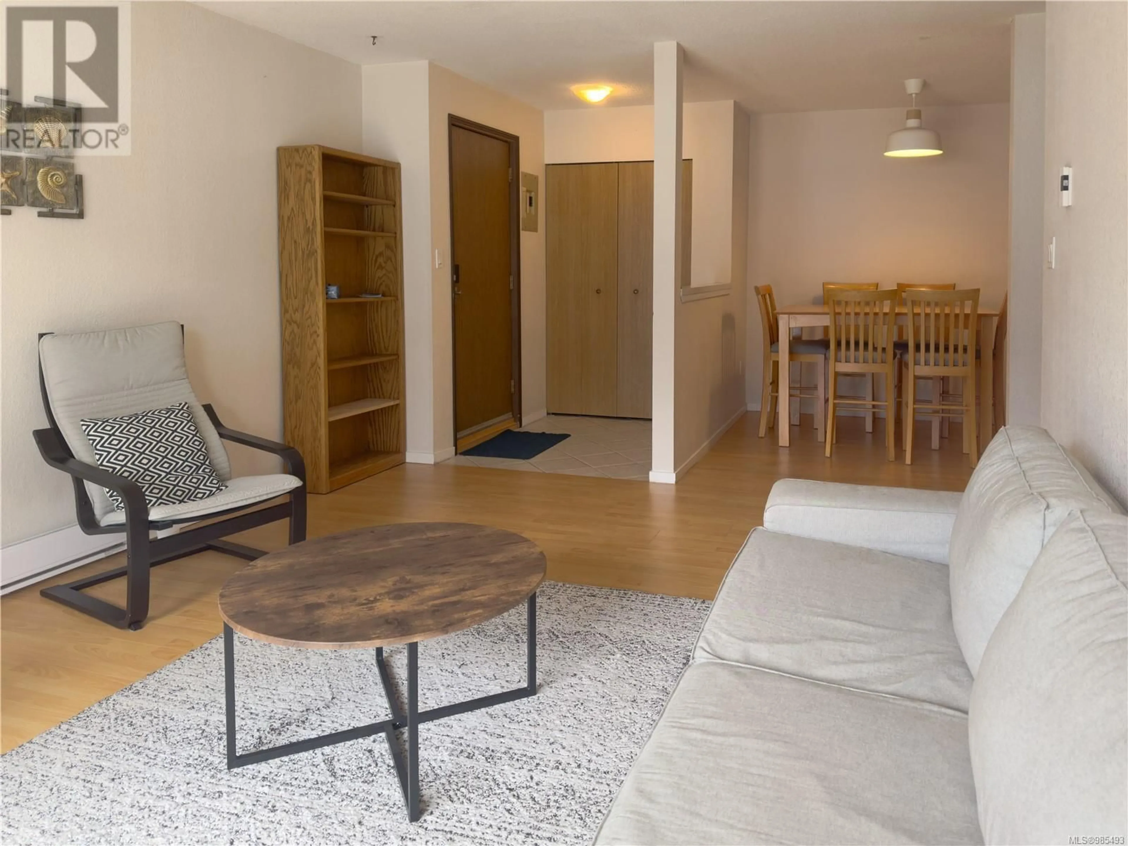 Living room with furniture, wood/laminate floor for 206 791 Marine Dr, Port Alice British Columbia V0N2N0