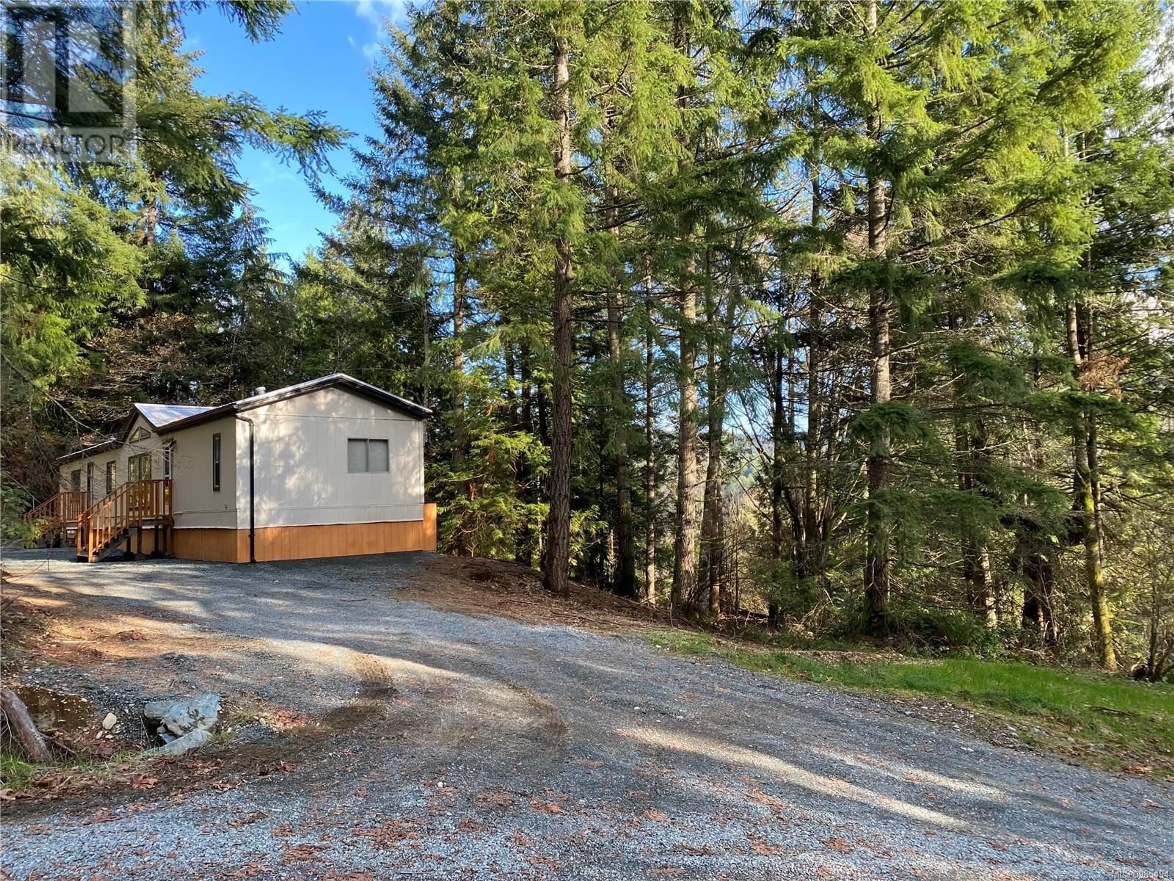 A pic from outside/outdoor area/front of a property/back of a property/a pic from drone, forest/trees view for 8018 Trans Canada Hwy, Duncan British Columbia V9L3R9