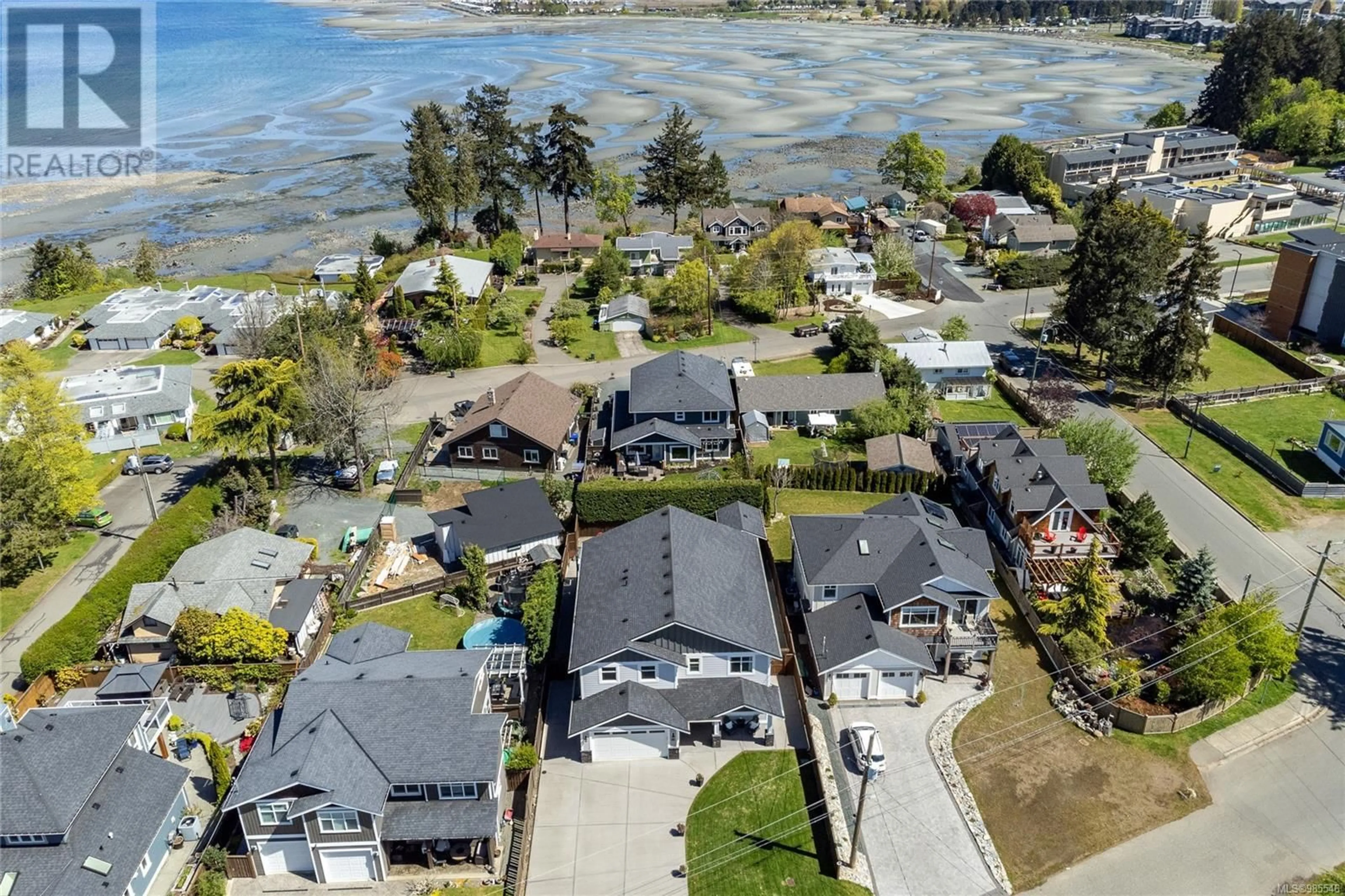 A pic from outside/outdoor area/front of a property/back of a property/a pic from drone, water/lake/river/ocean view for 318 Wisteria St, Parksville British Columbia V9P1E1