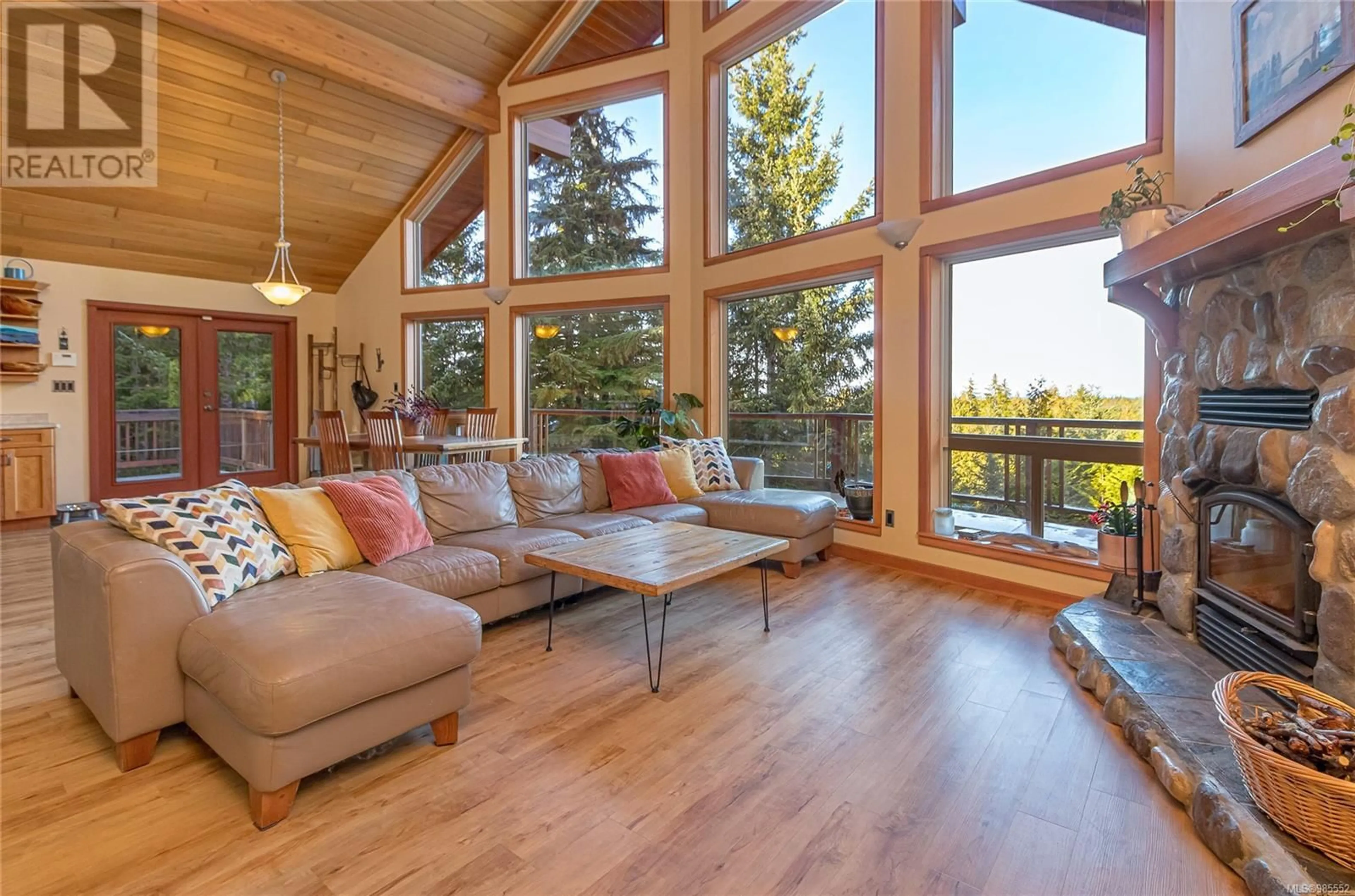 Living room with furniture, wood/laminate floor for 1556 Meadowood Way, Qualicum Beach British Columbia V9K2V2