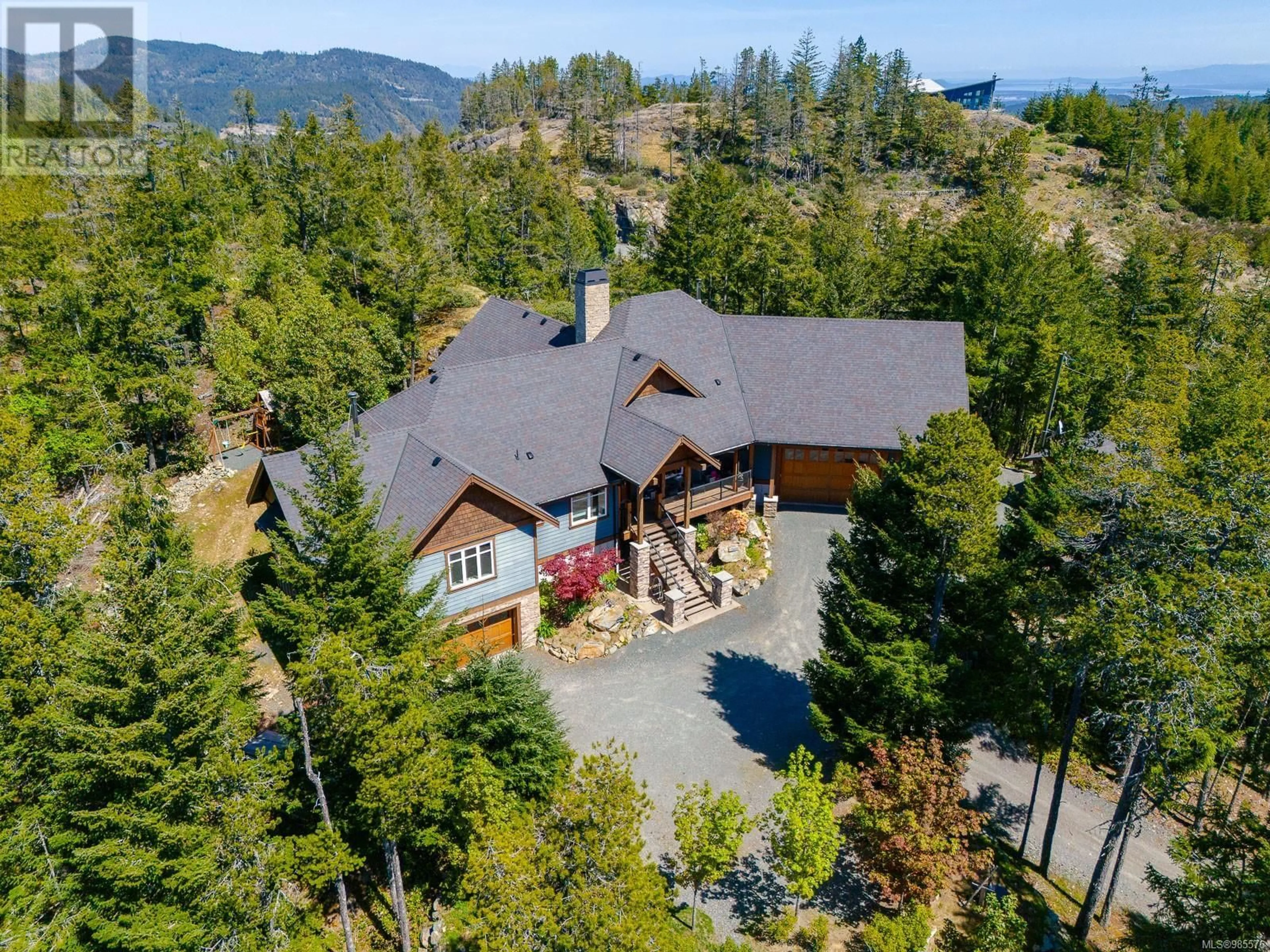 A pic from outside/outdoor area/front of a property/back of a property/a pic from drone, mountain view for 4270 Goldstream Heights Dr, Shawnigan Lake British Columbia V0R2W3