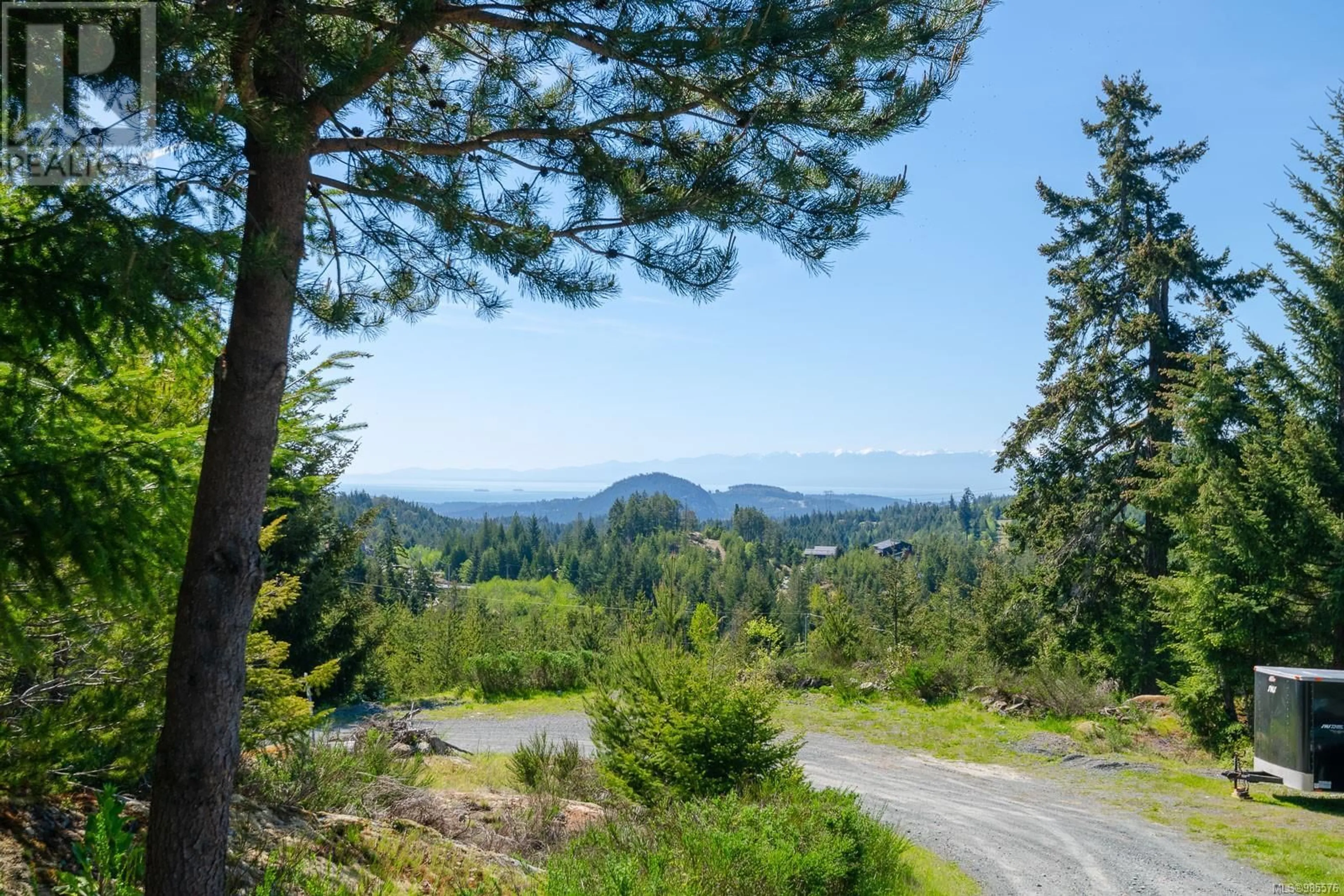 A pic from outside/outdoor area/front of a property/back of a property/a pic from drone, forest/trees view for 4270 Goldstream Heights Dr, Shawnigan Lake British Columbia V0R2W3