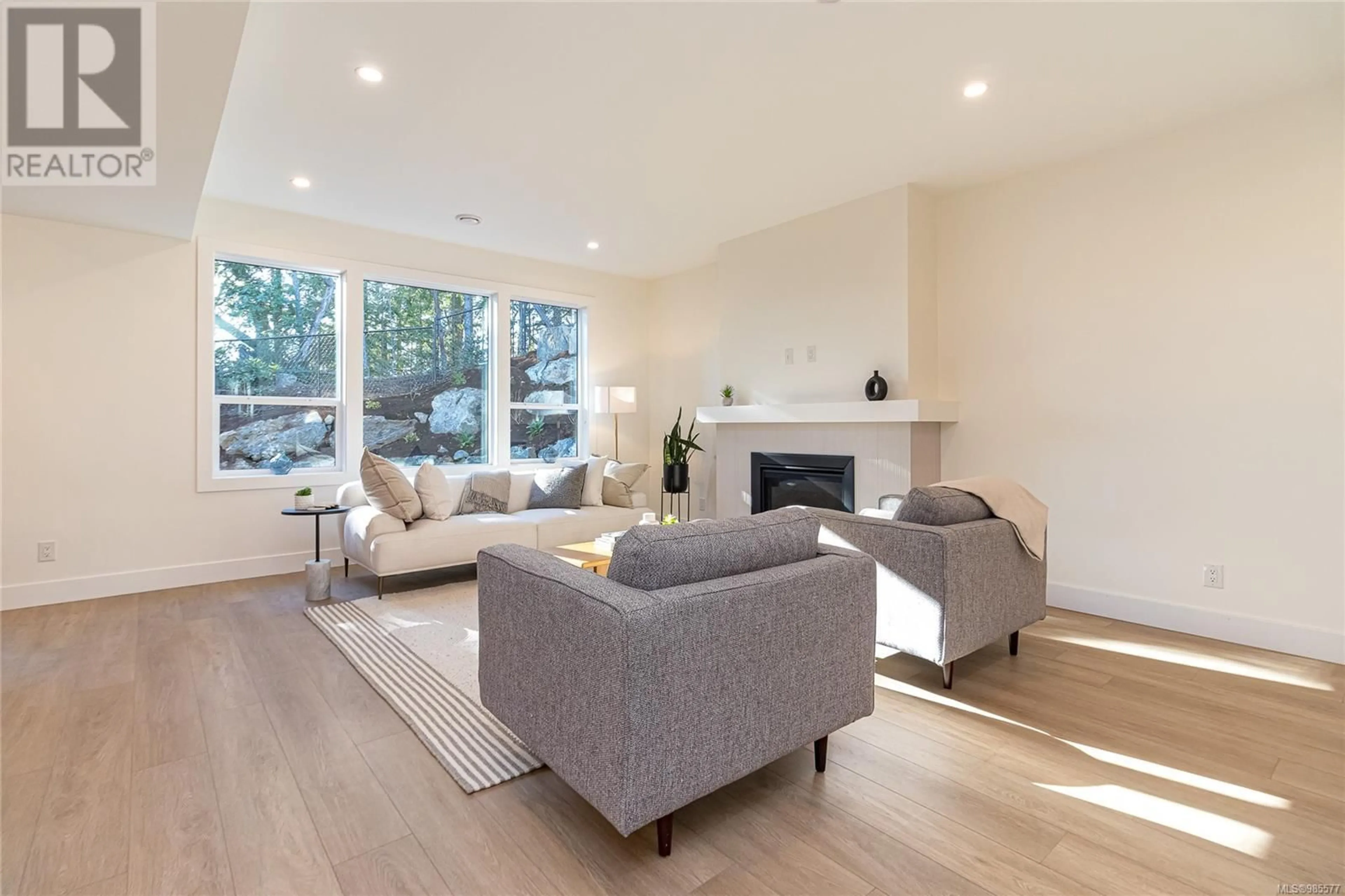 Living room with furniture, wood/laminate floor for 1236 Ashmore Terr, Langford British Columbia V9C0S6